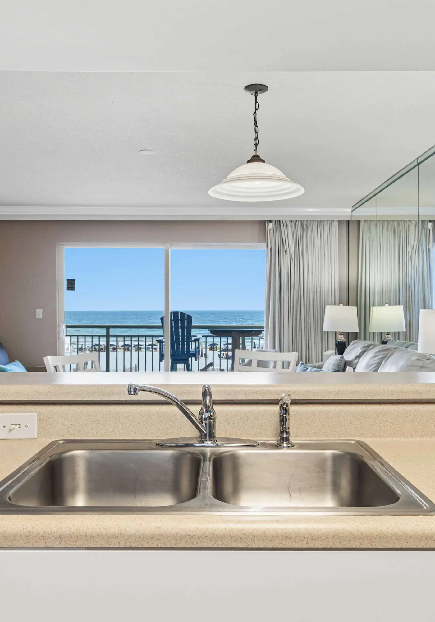 Stylish beach getaway with shared pool, private balcony, gulf views & fast WiFi