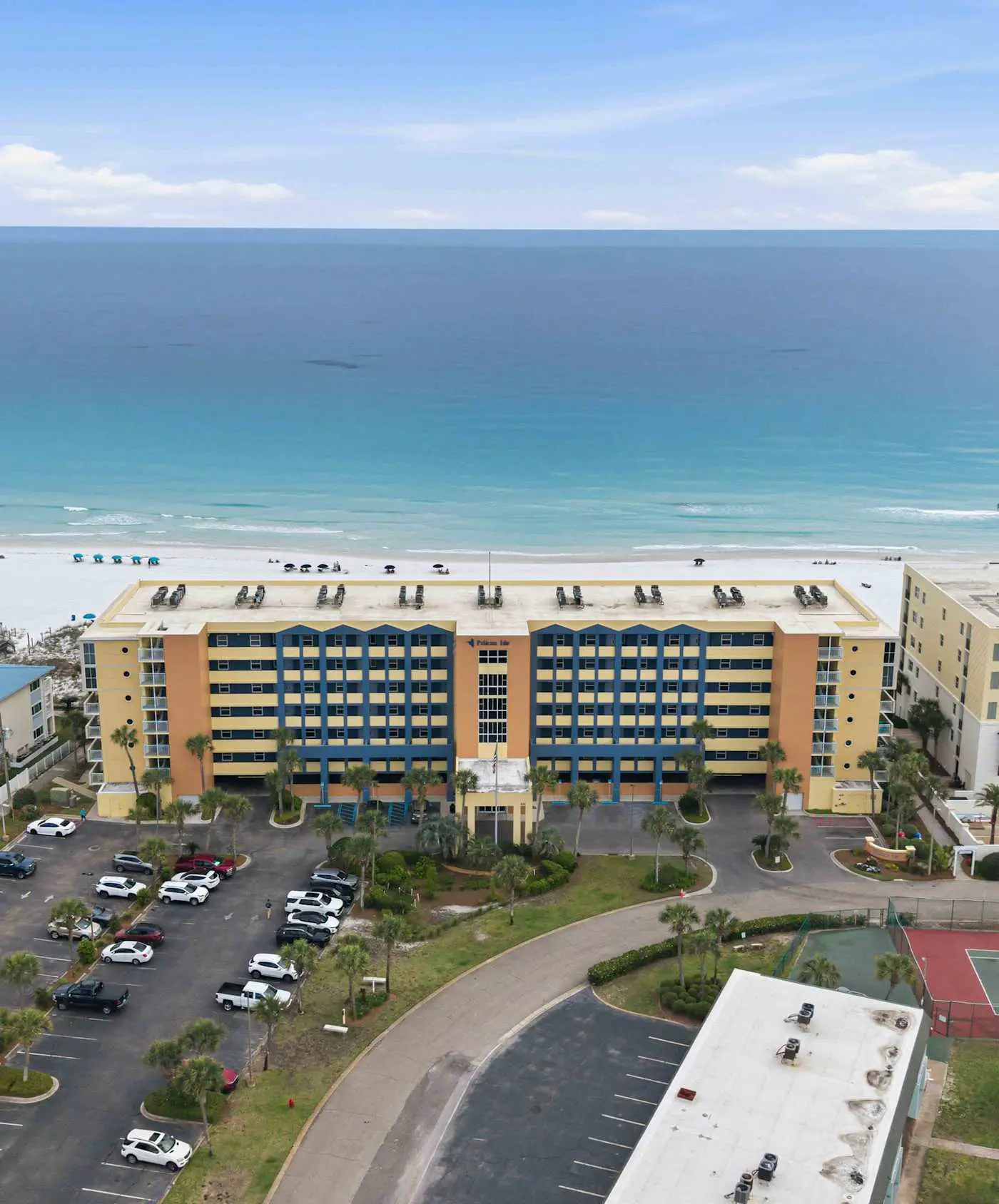 Stylish beach getaway with shared pool, private balcony, gulf views & fast WiFi