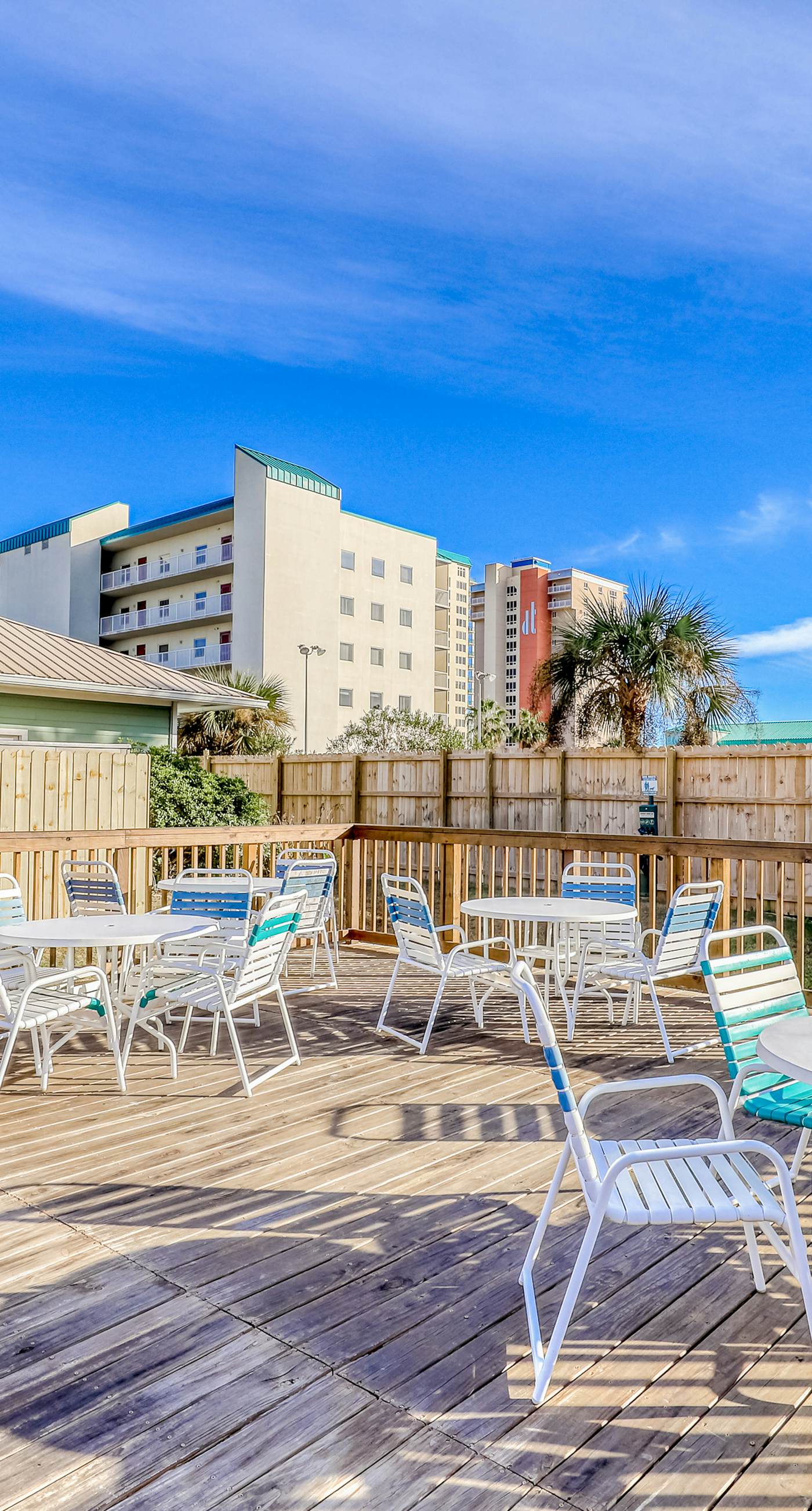 Ground-floor condo 1/2 block from the beach with patio, central AC, pool & WiFi