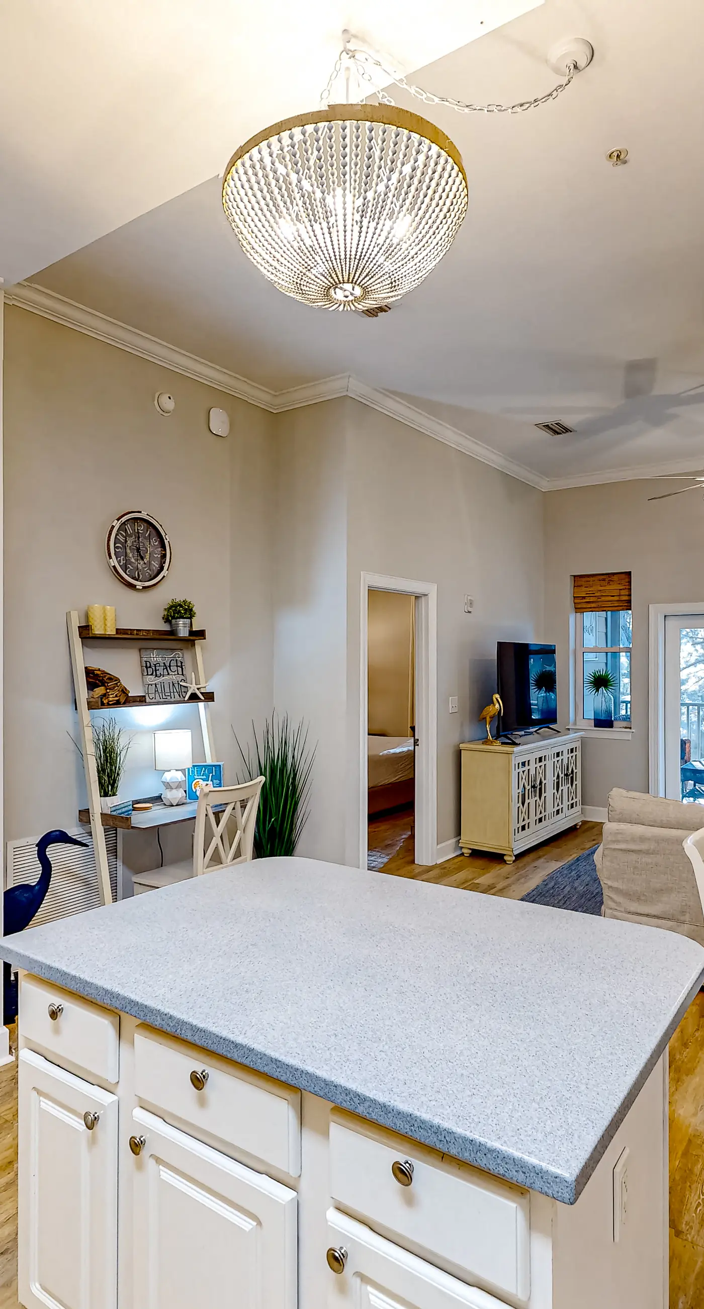 4th-floor condo near the beach with balcony, outdoor pool, elevator, W/D, & AC