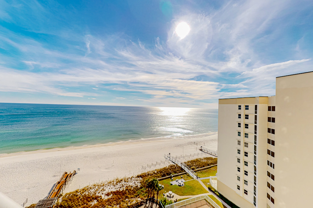 Gulf-front condo with pools, hot tub, beach access & views