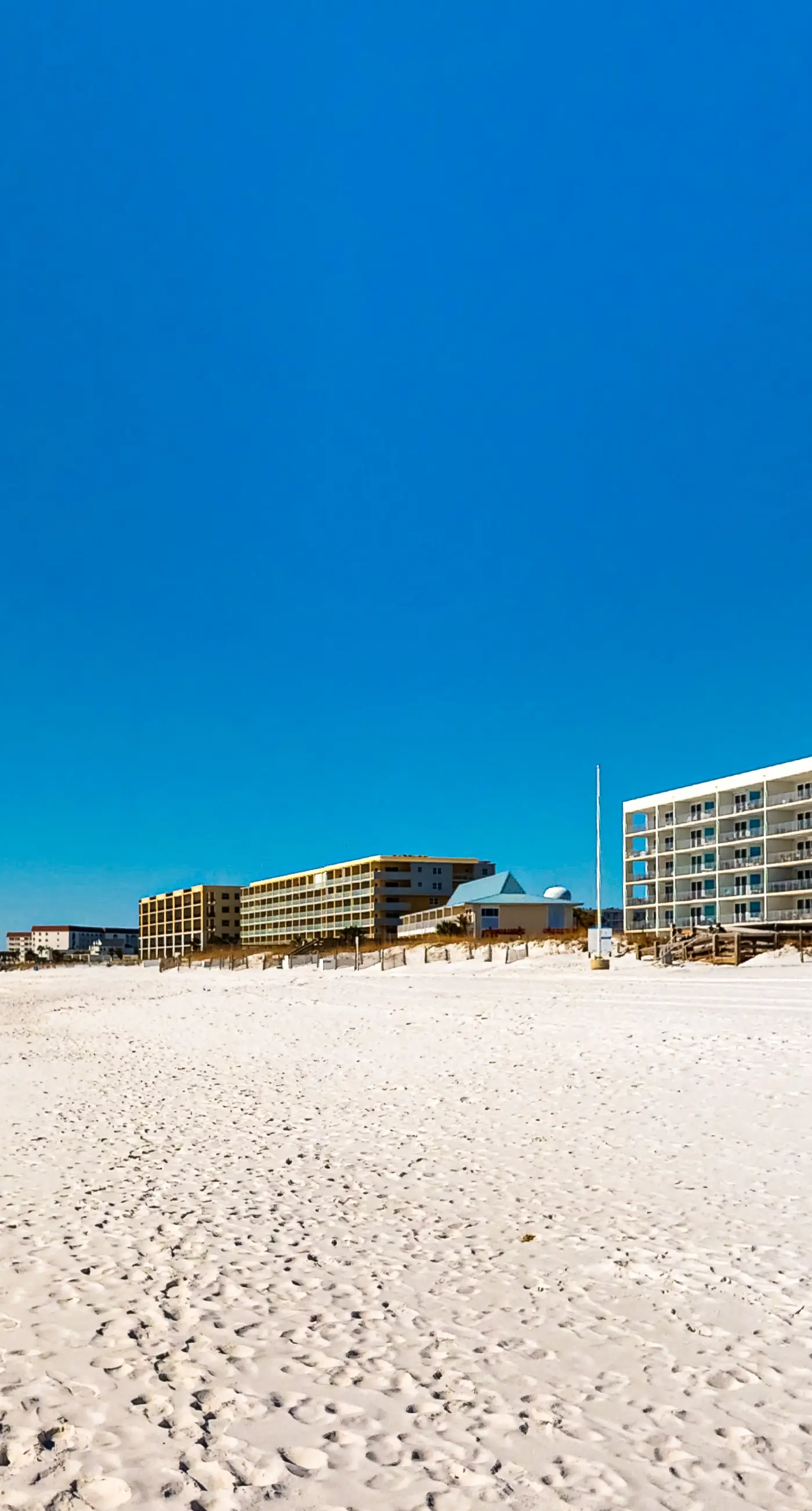 Seventh floor condo with pool access, washer&dryer, ocean view, & central AC