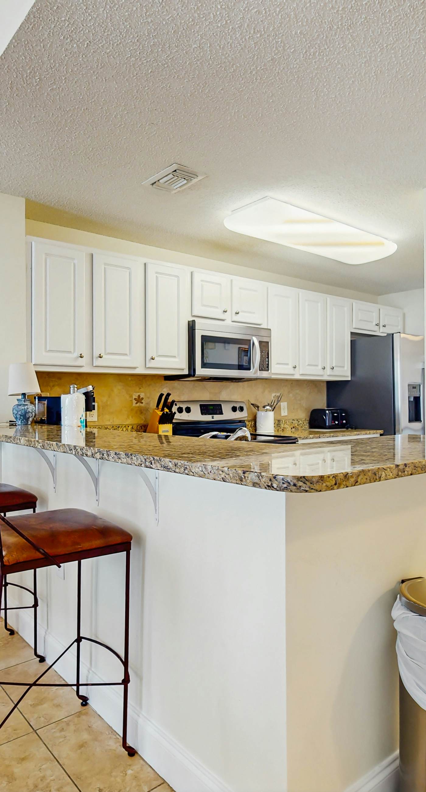 Gulf-front snowbird-friendly condo with pools, tennis, hot tub, balcony, gym, AC