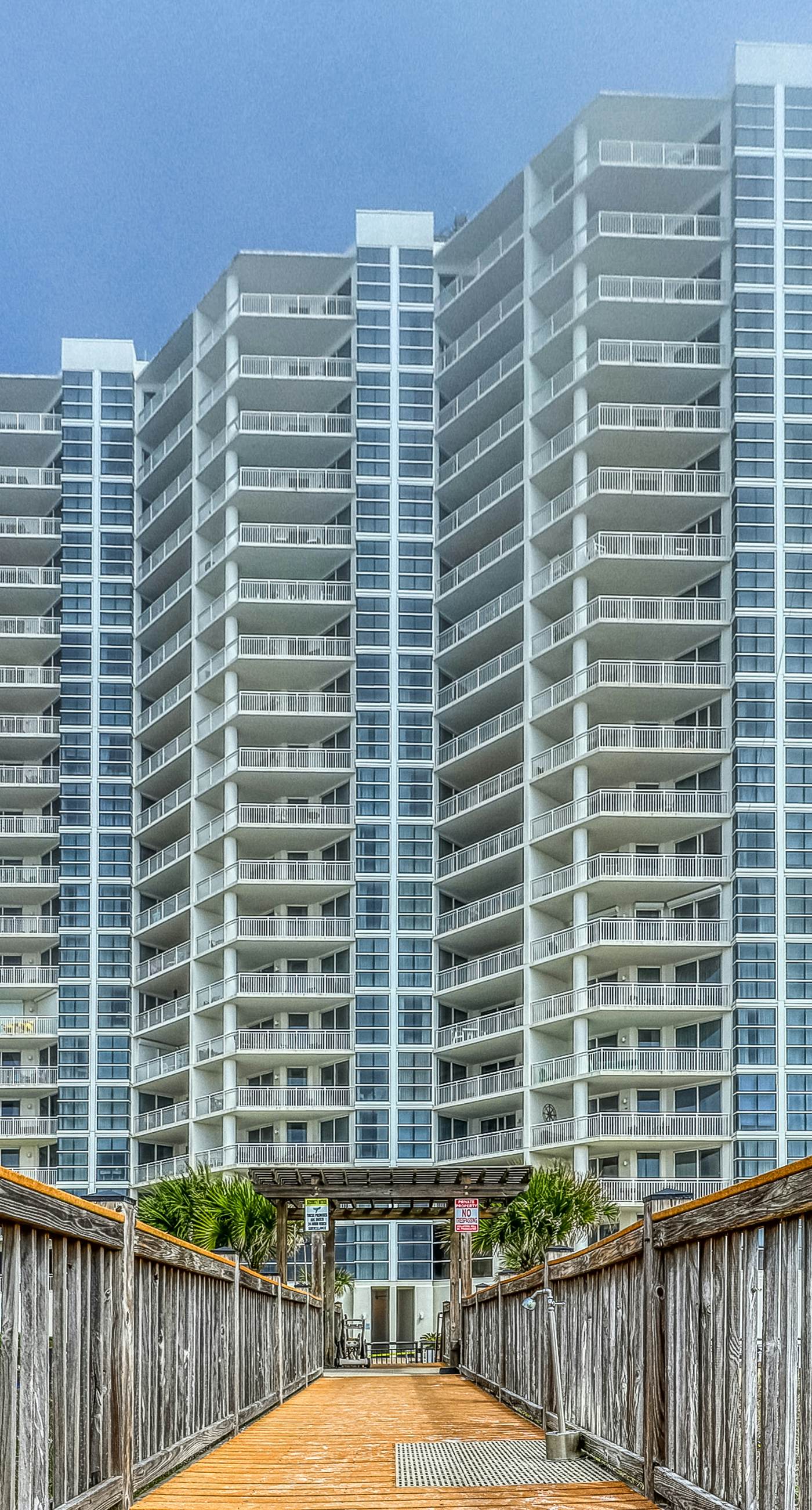 Gulf-front snowbird-friendly condo with pools, tennis, hot tub, balcony, gym, AC