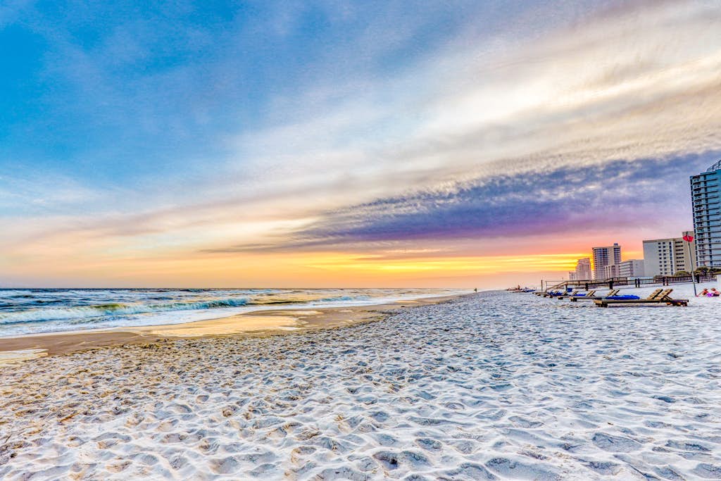Gulf-front snowbird-friendly condo with pools, tennis, hot tub, balcony, gym, AC