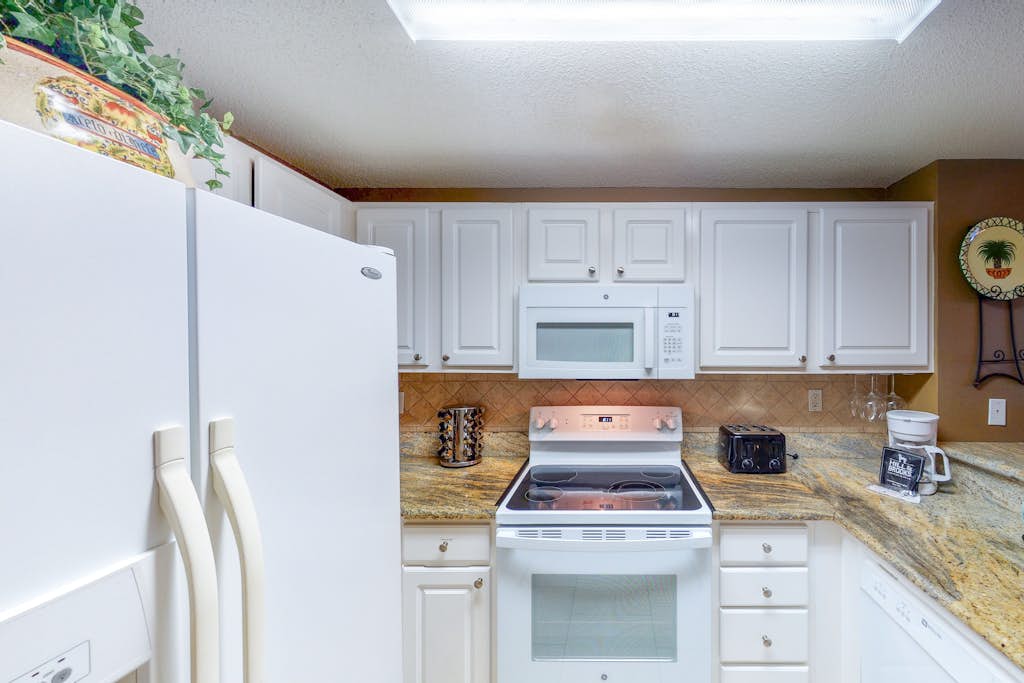 Coastal condo steps to beach with pools, hot tub, gym & amazing views