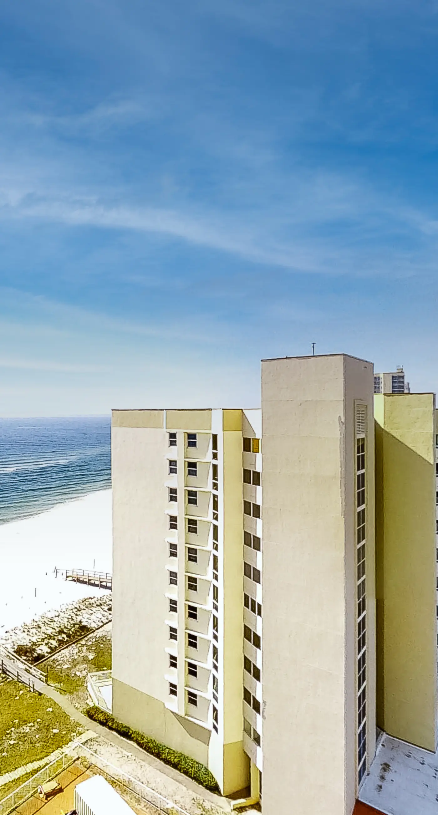 Coastal condo steps to beach with pools, hot tub, gym & amazing views