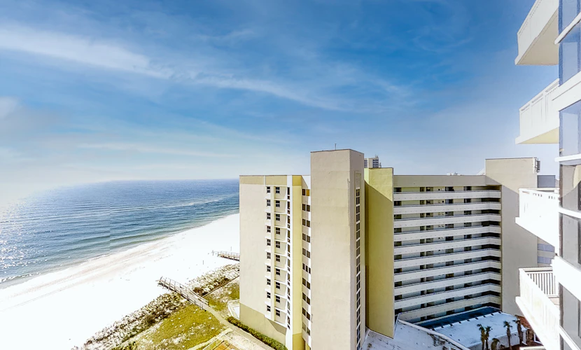 Coastal condo steps to beach with pools, hot tub, gym & amazing views