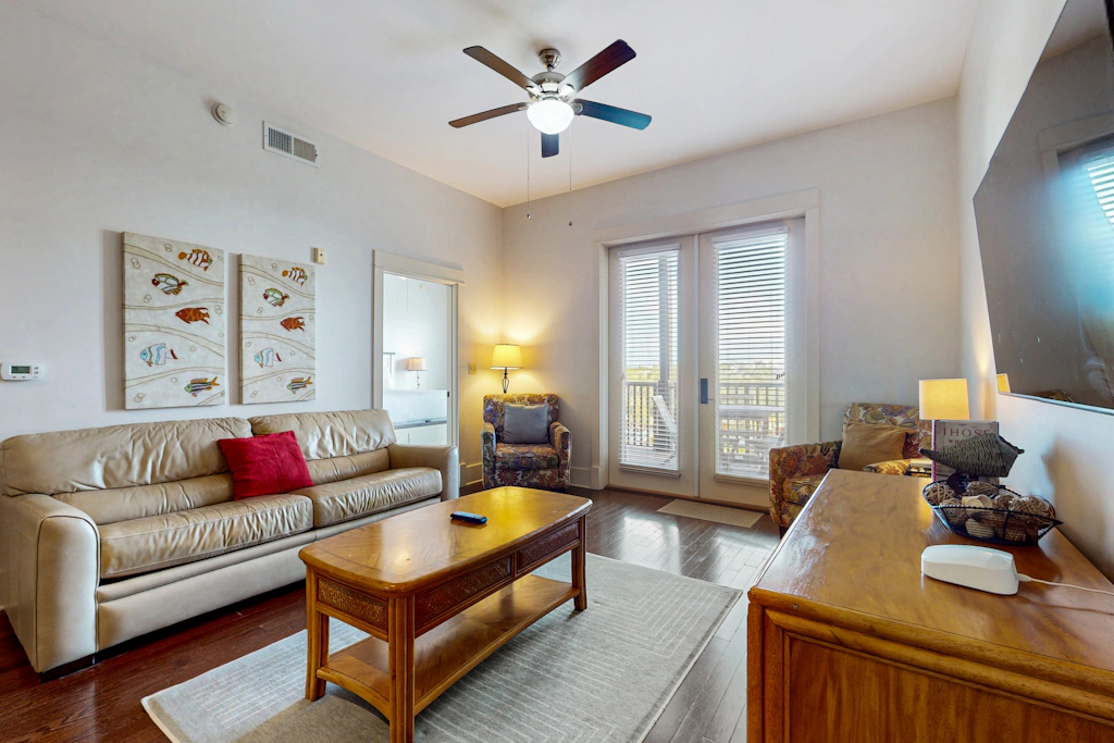 Polished condo with balcony & pools - one block from the beach