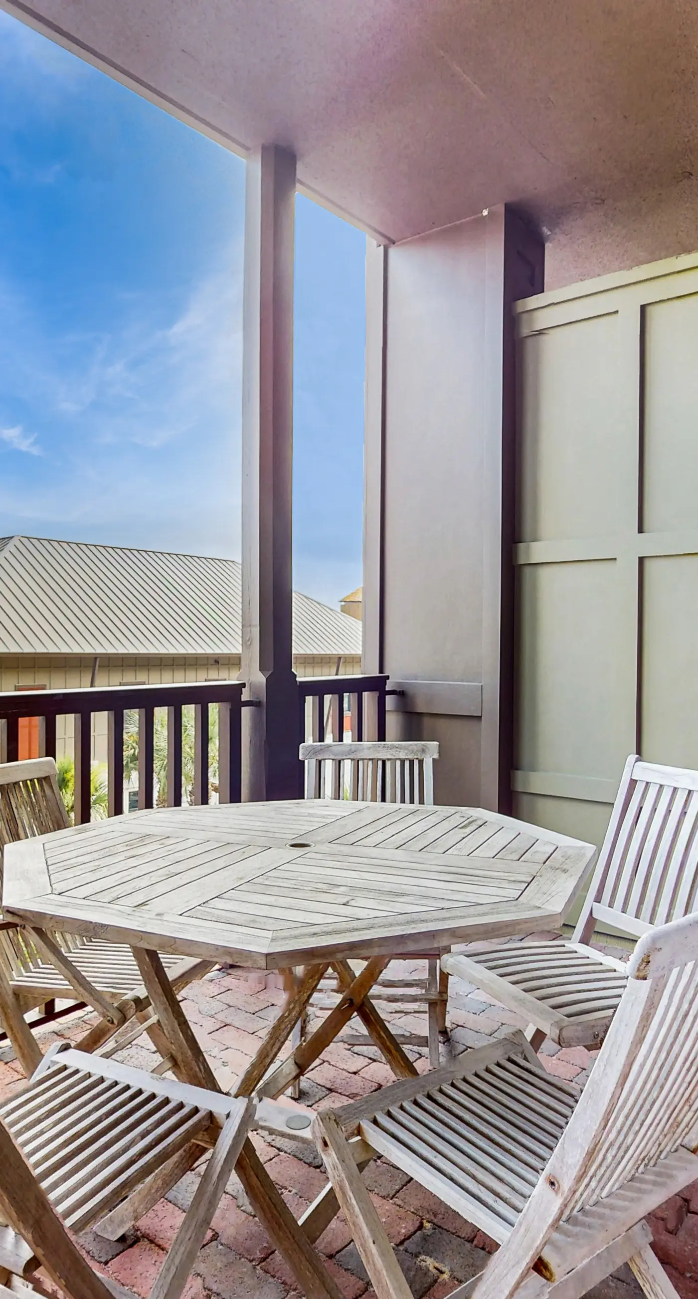 Polished condo with balcony & pools - one block from the beach