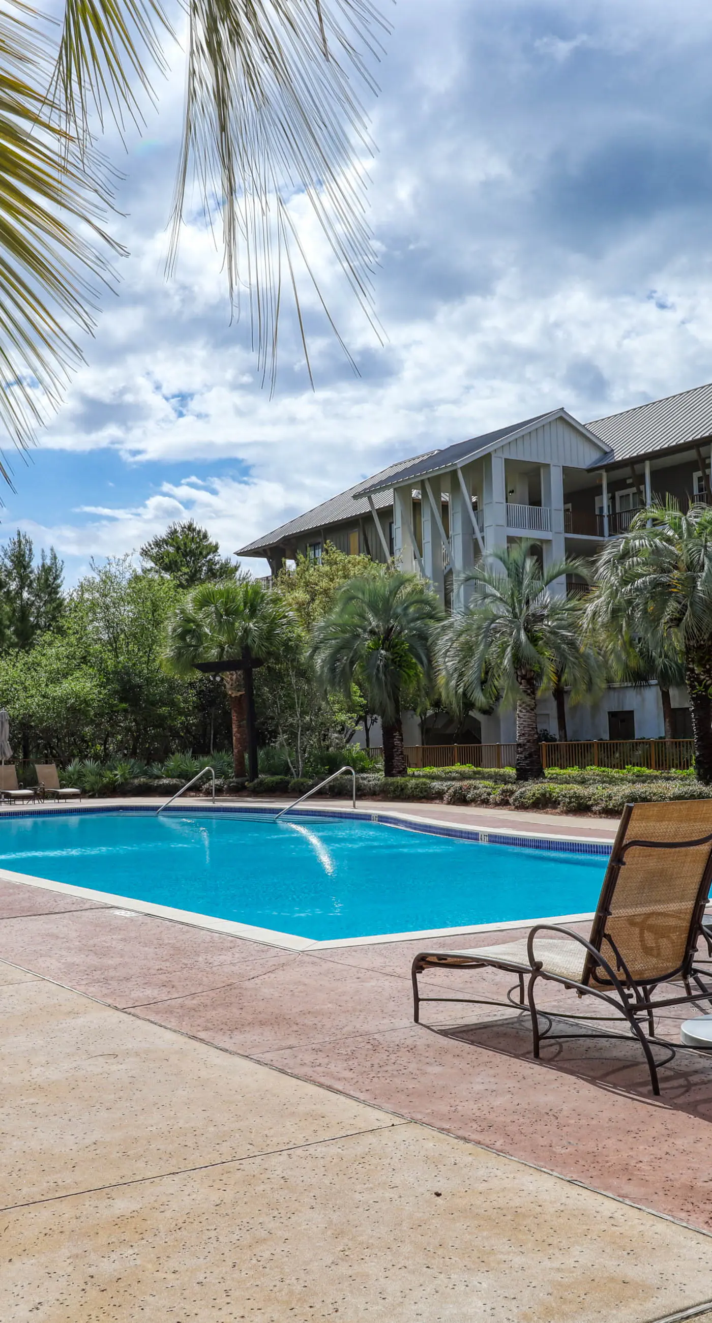 Polished condo with balcony & pools - one block from the beach