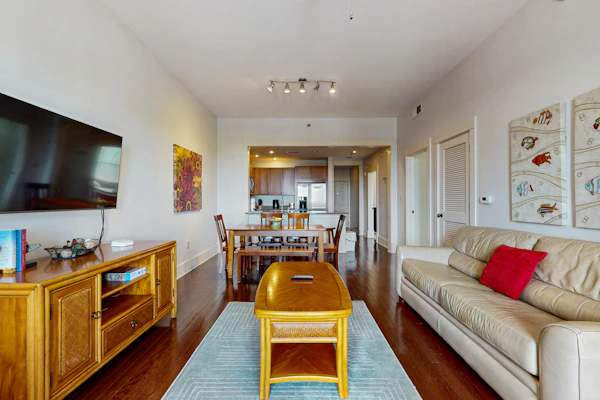 Polished condo with balcony & pools - one block from the beach