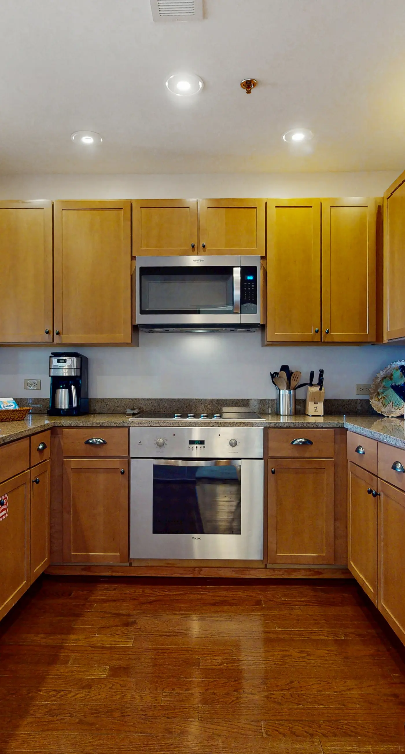 Polished condo with balcony & pools - one block from the beach