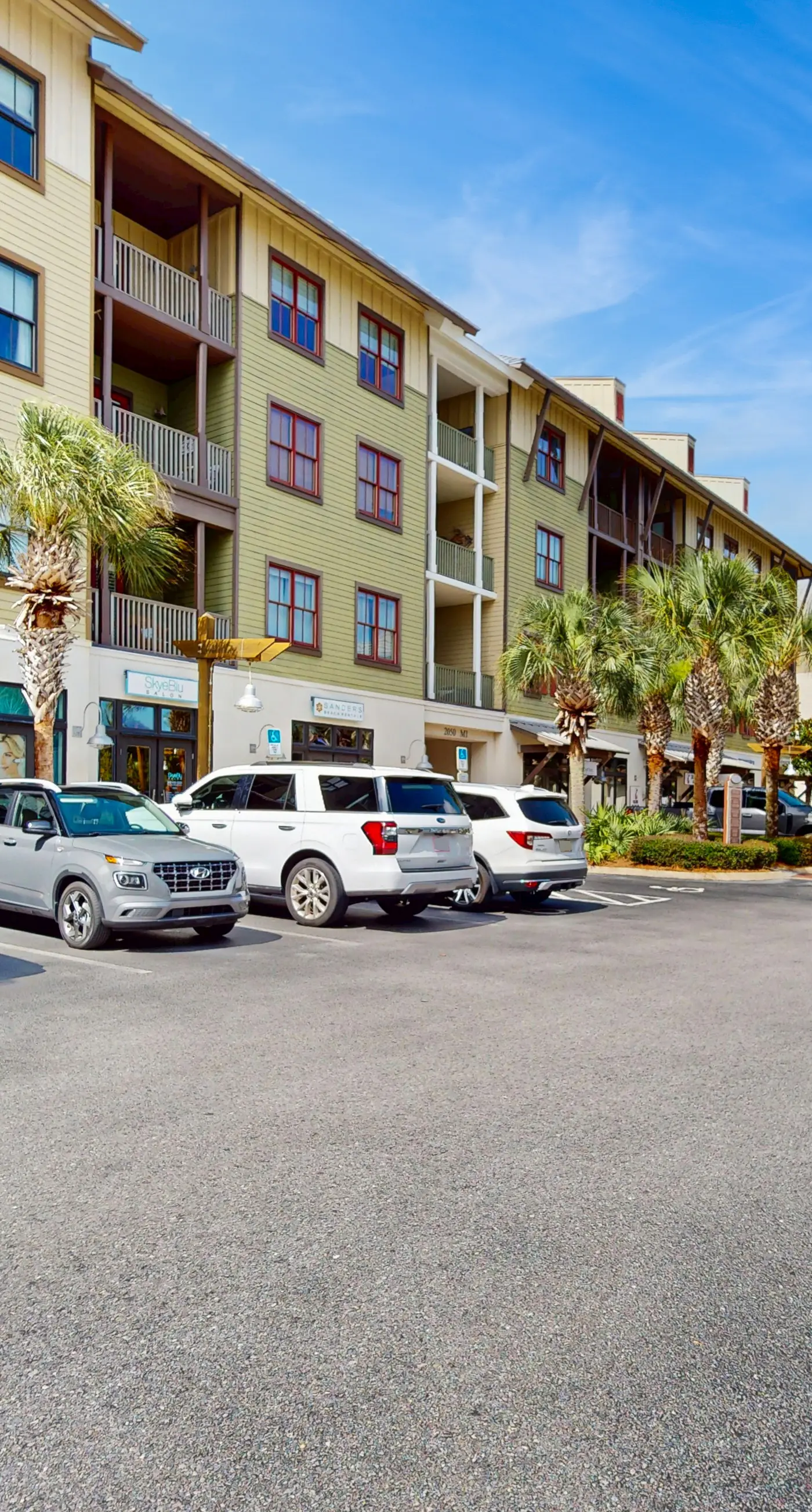 Polished condo with balcony & pools - one block from the beach