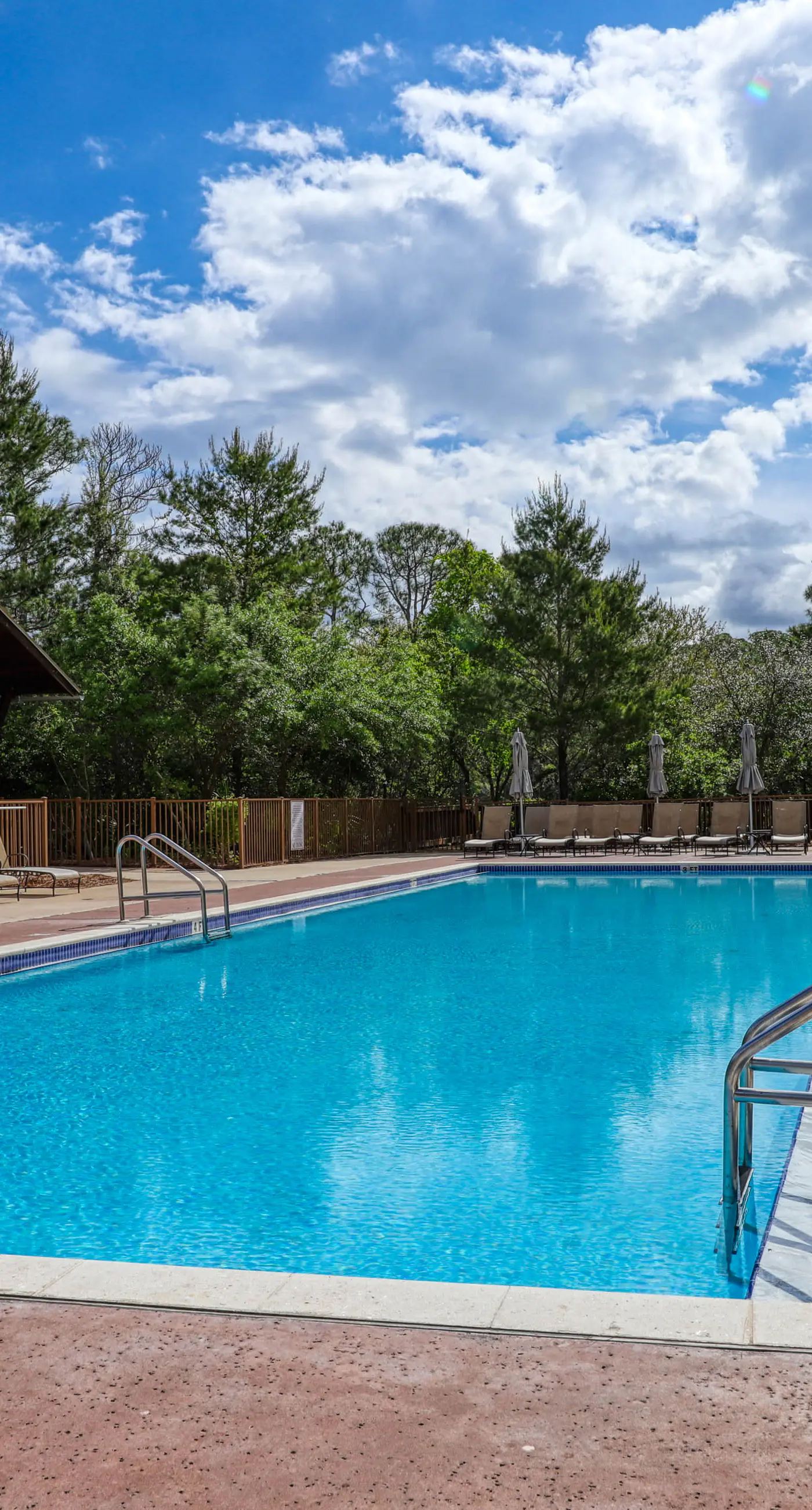 Polished condo with balcony & pools - one block from the beach