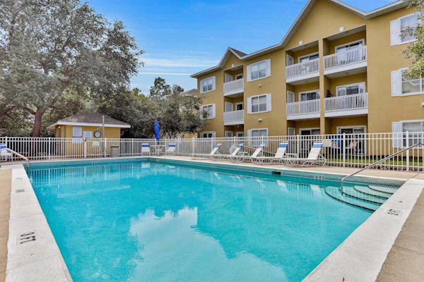 Peaceful condo with pool access, central AC, and washer&dryer