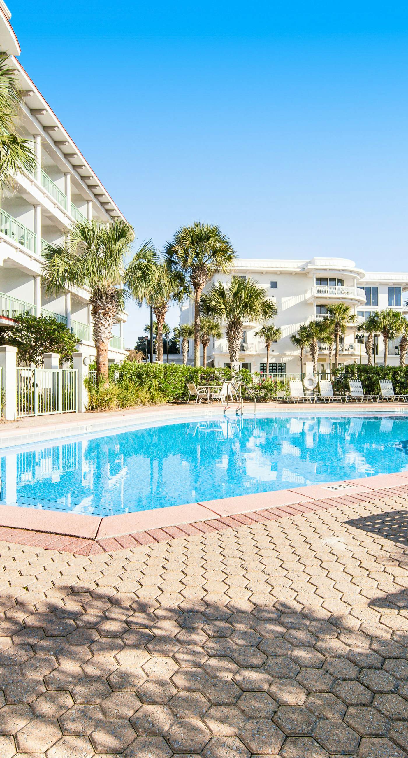 Comfortable studio with shared outdoor pool, hot tub, BBQ area, and pool views