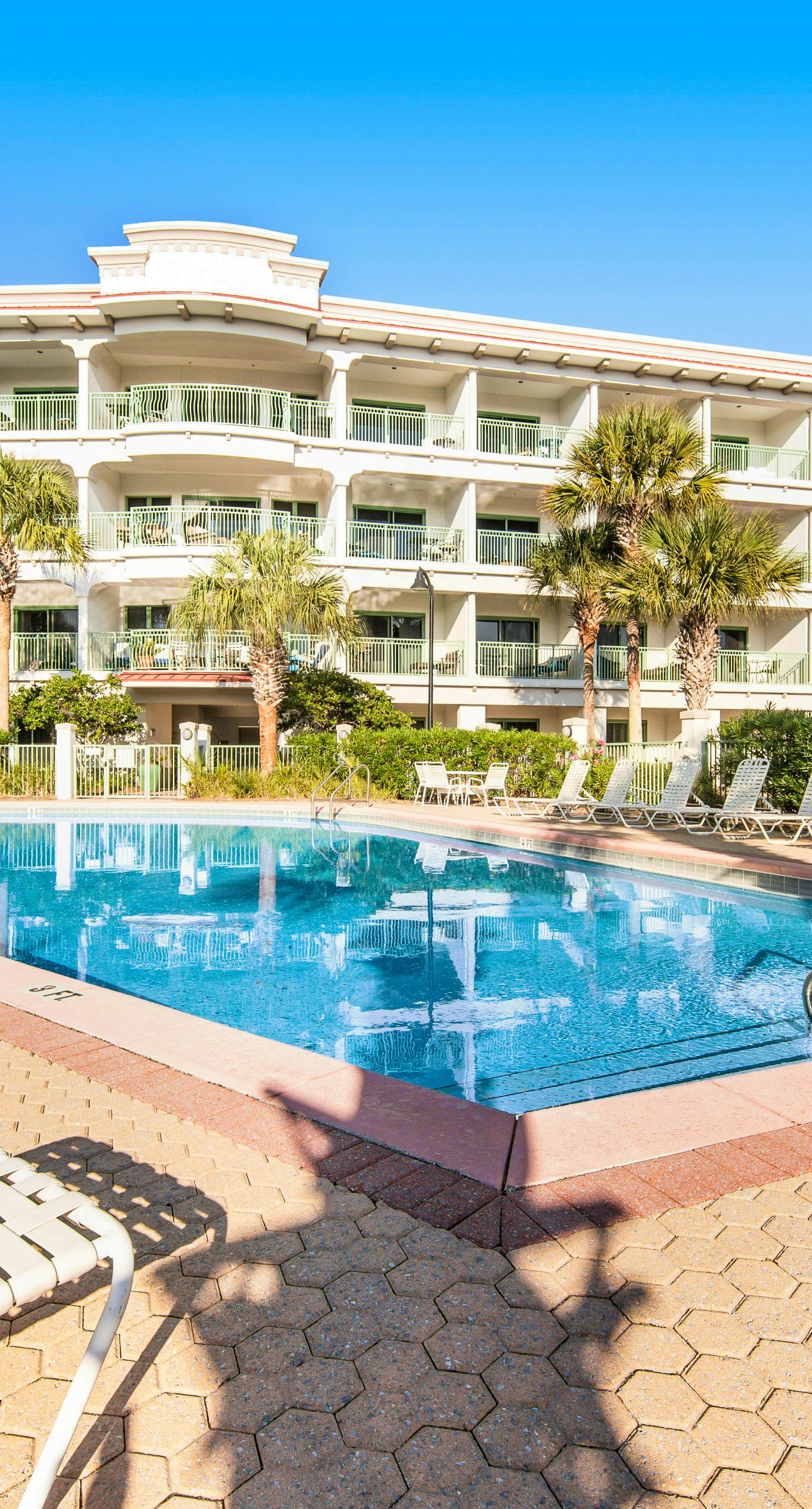 Comfortable studio with shared outdoor pool, hot tub, BBQ area, and pool views