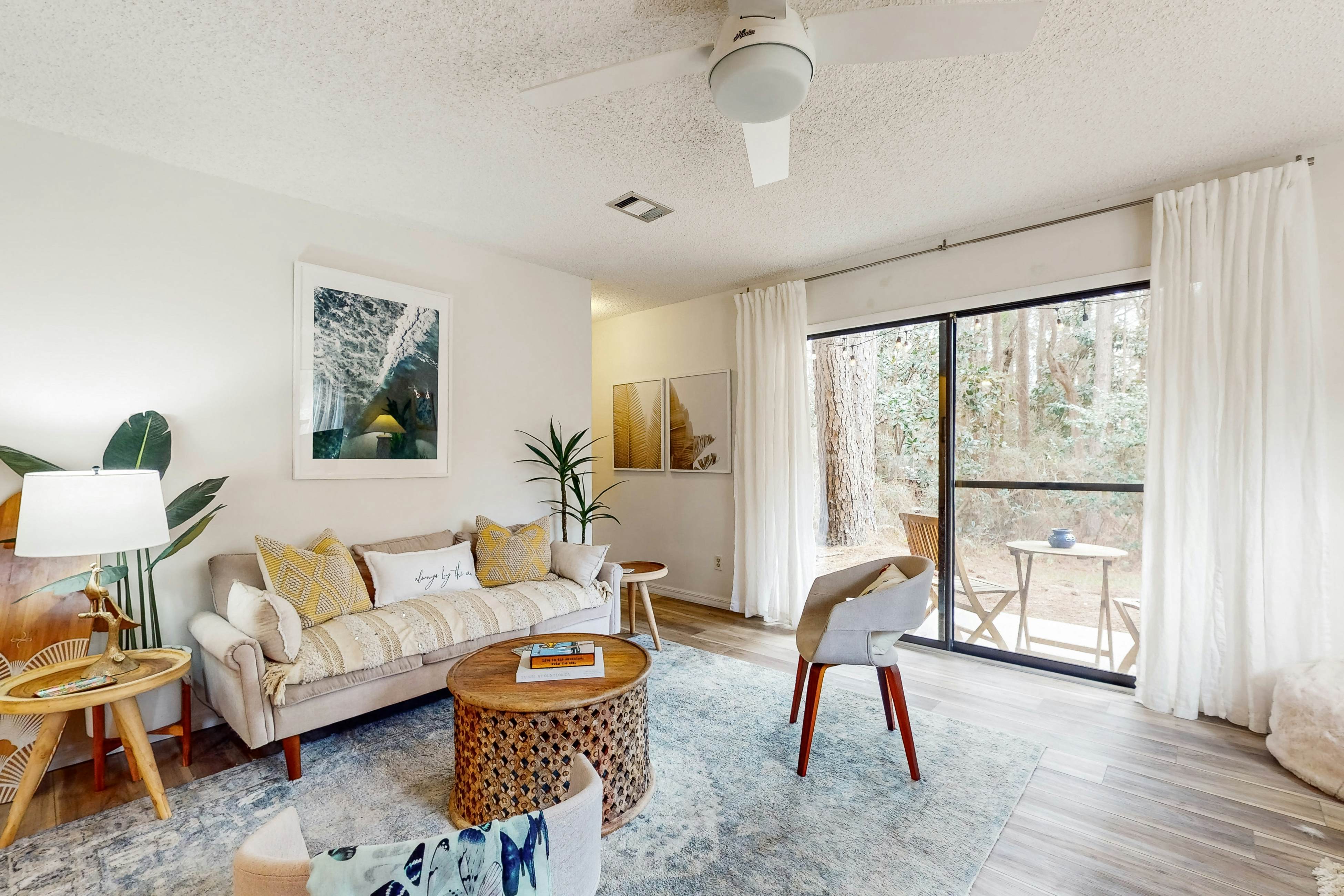 Boho condo with outdoor pool, tennis, covered terraces, & serene woodsy views