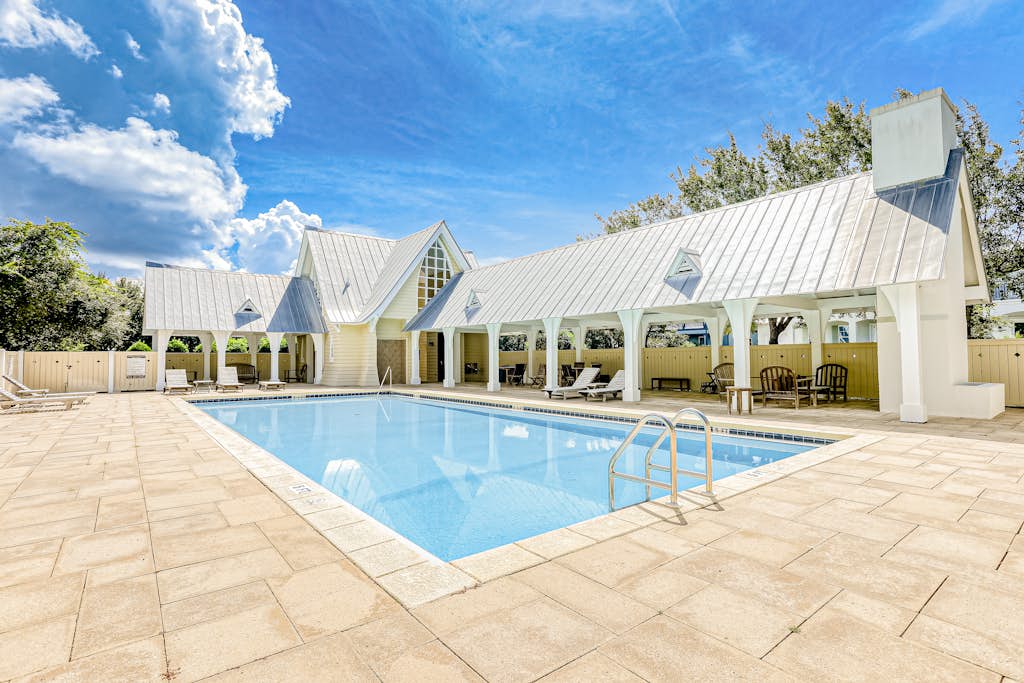 Dog-friendly home with community pool, flat top grill, and custom coffee bar