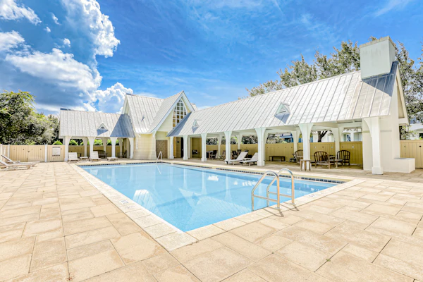 Dog-friendly home with community pool, flat top grill, and custom coffee bar