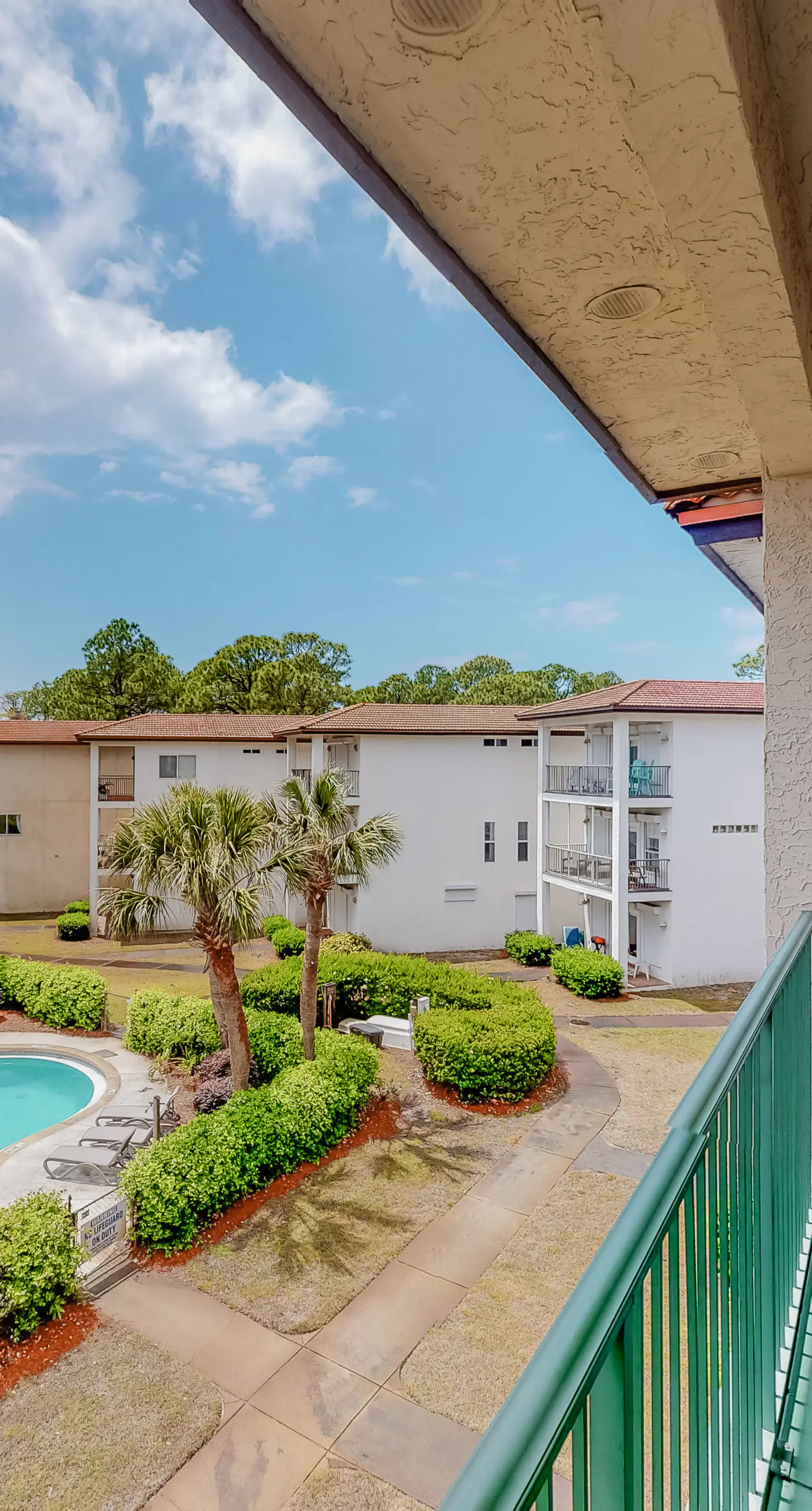Three-level home with two kitchens, two decks, lanai, pool & ocean view