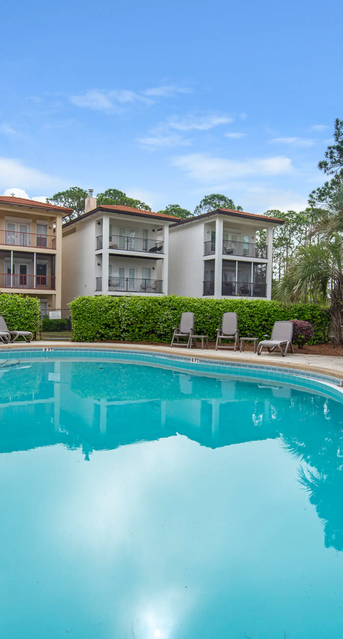 Three-level home with two kitchens, two decks, lanai, pool & ocean view