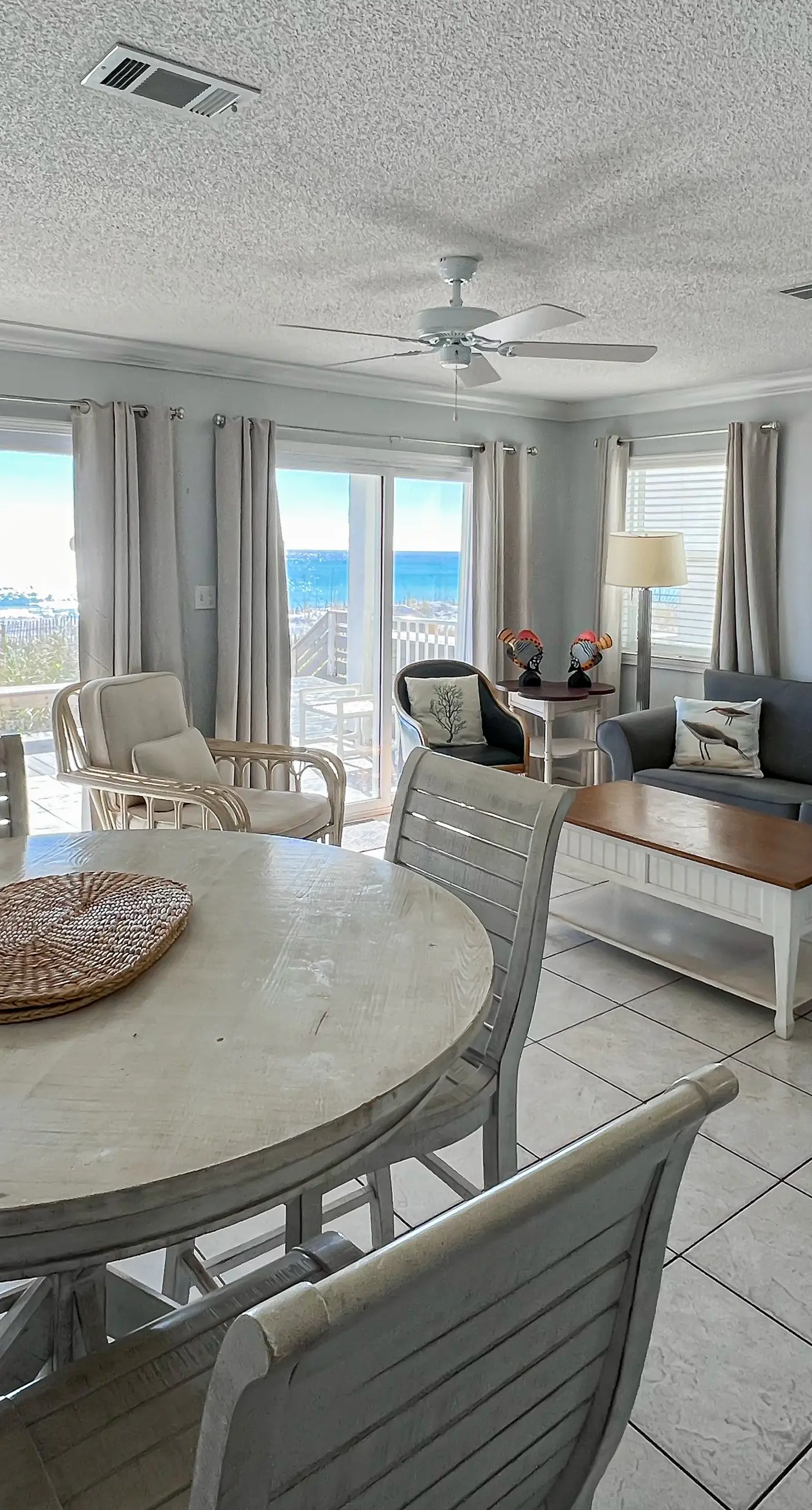 Lovely first floor condo with ocean views, patio, & grill - steps from the beach