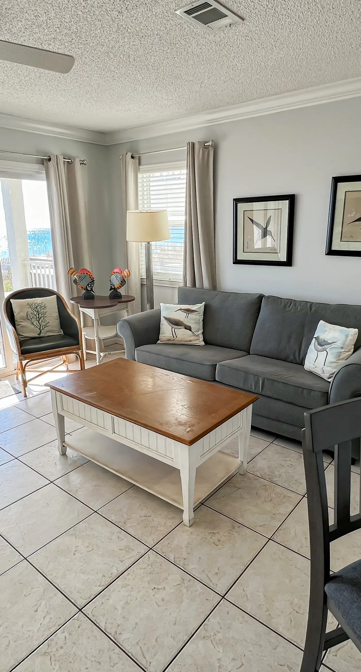 Lovely first floor condo with ocean views, patio, & grill - steps from the beach