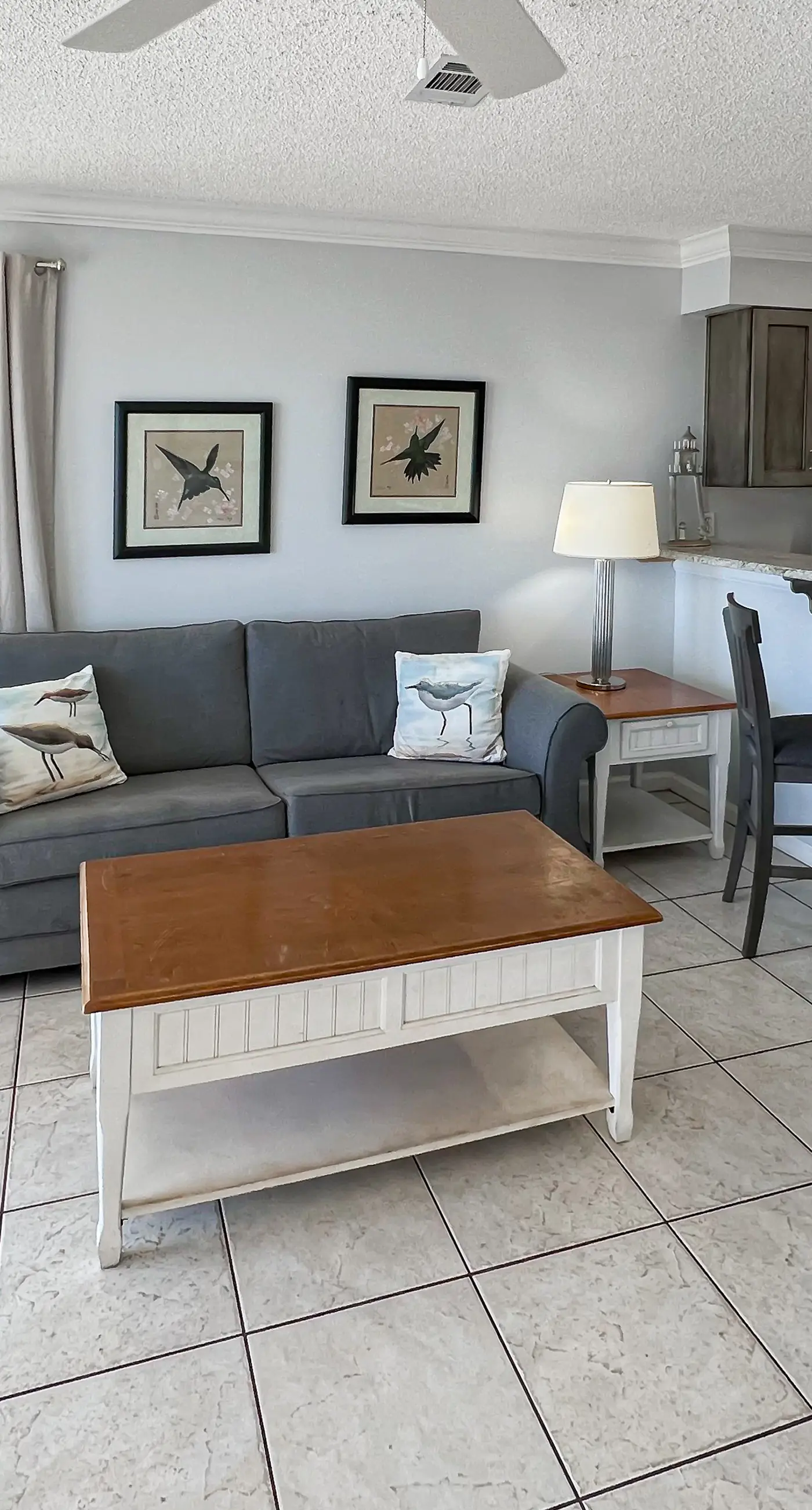 Lovely first floor condo with ocean views, patio, & grill - steps from the beach
