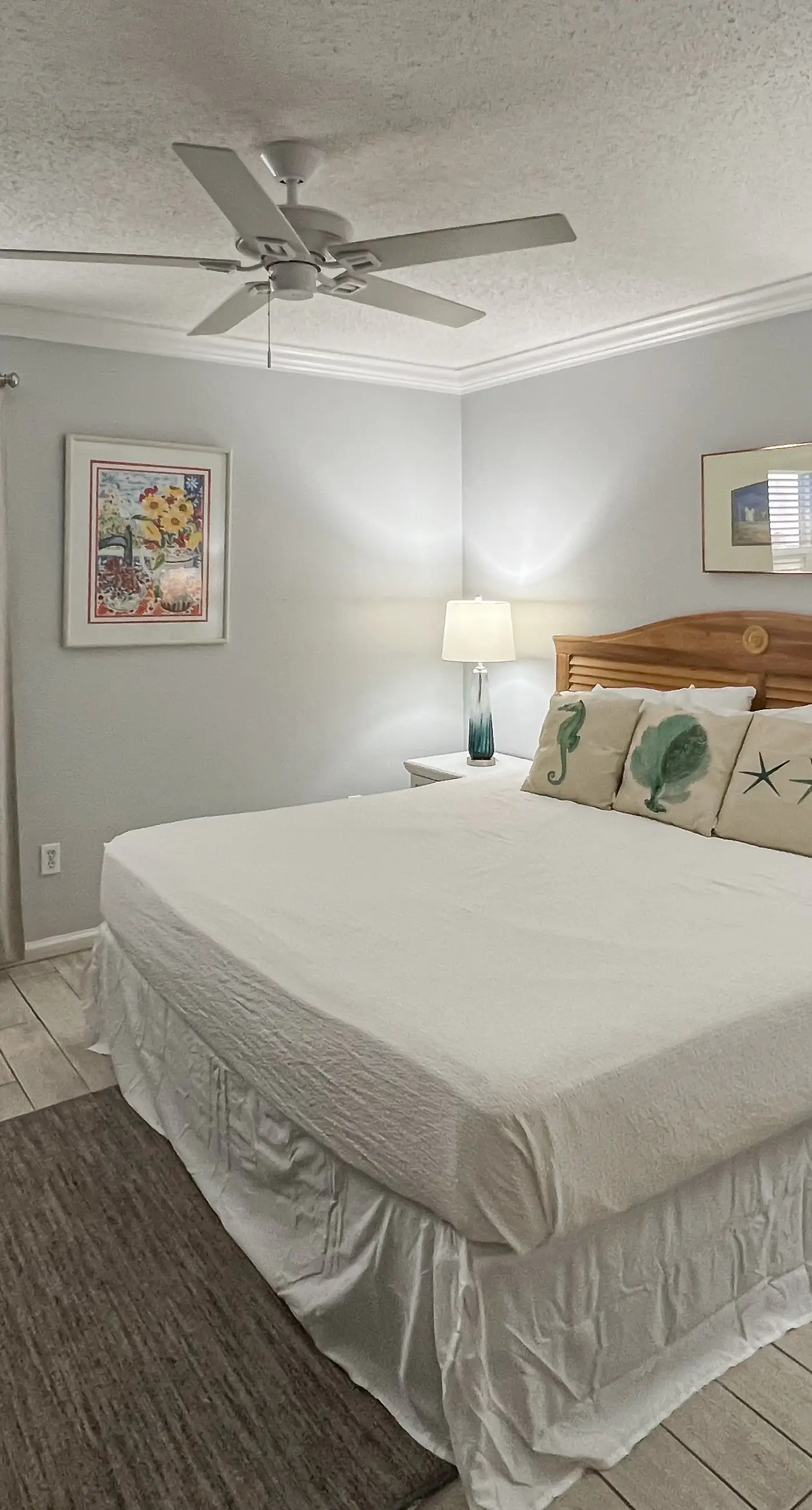 Lovely first floor condo with ocean views, patio, & grill - steps from the beach