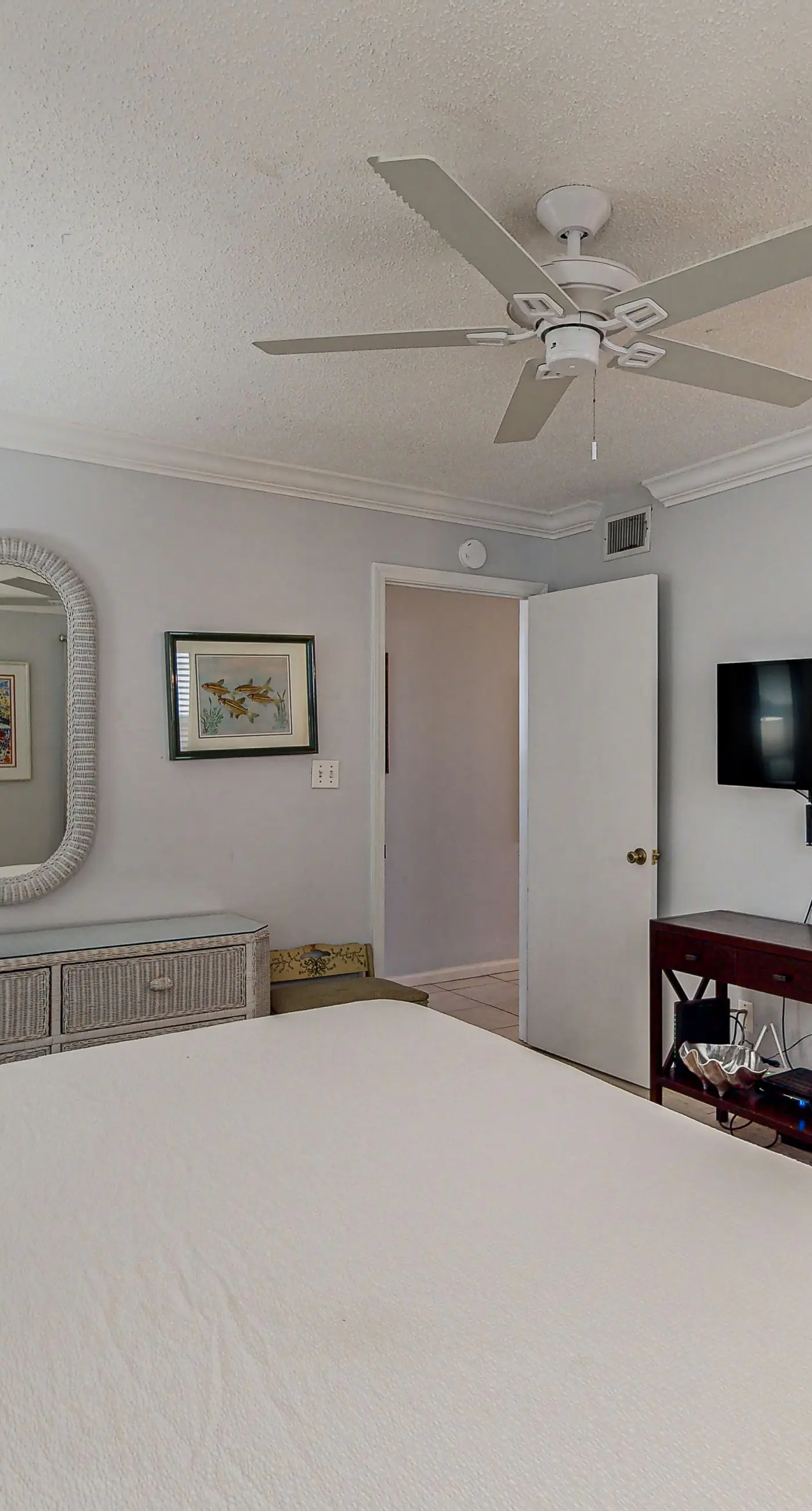 Lovely first floor condo with ocean views, patio, & grill - steps from the beach