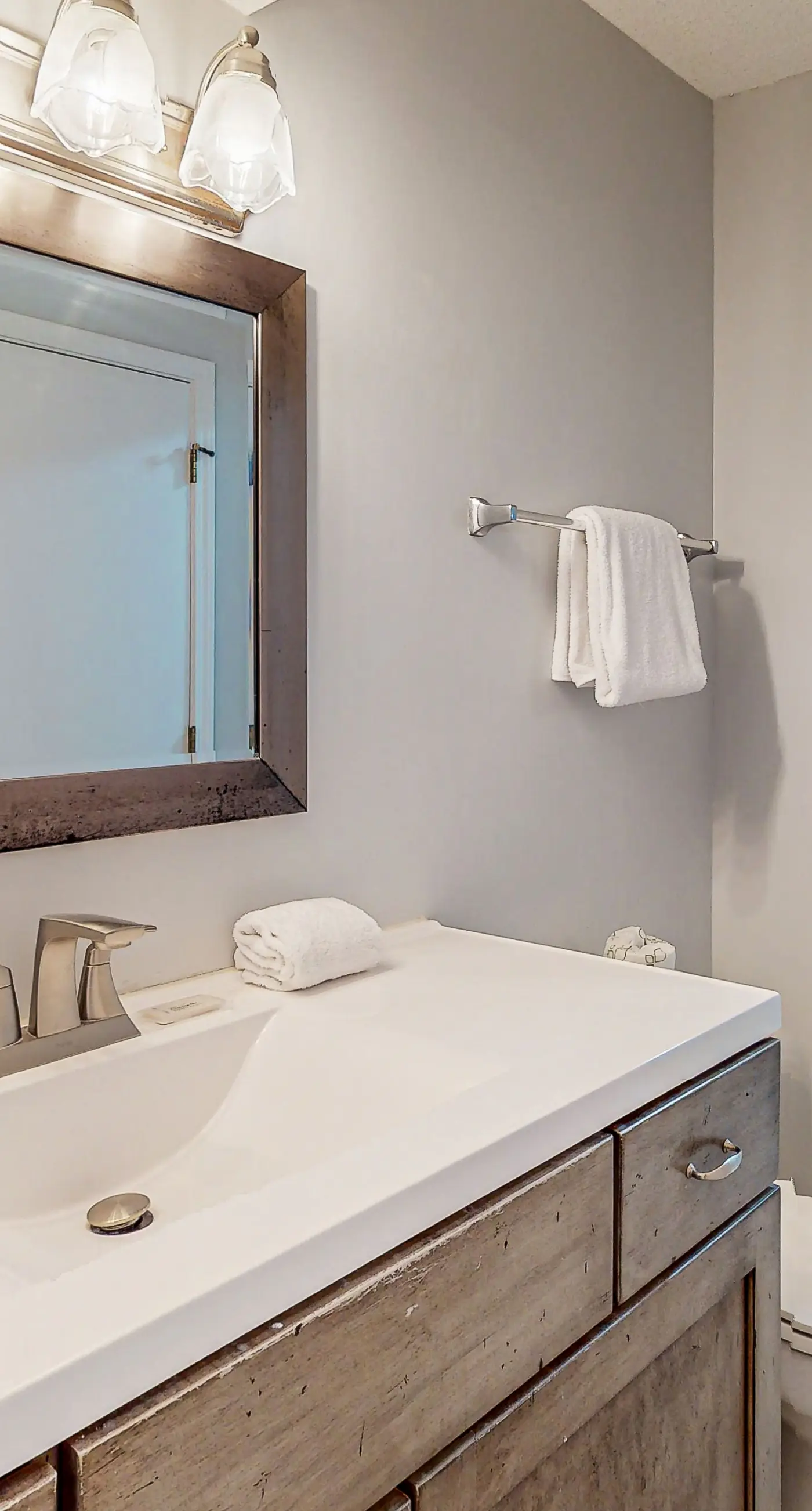 Lovely first floor condo with ocean views, patio, & grill - steps from the beach
