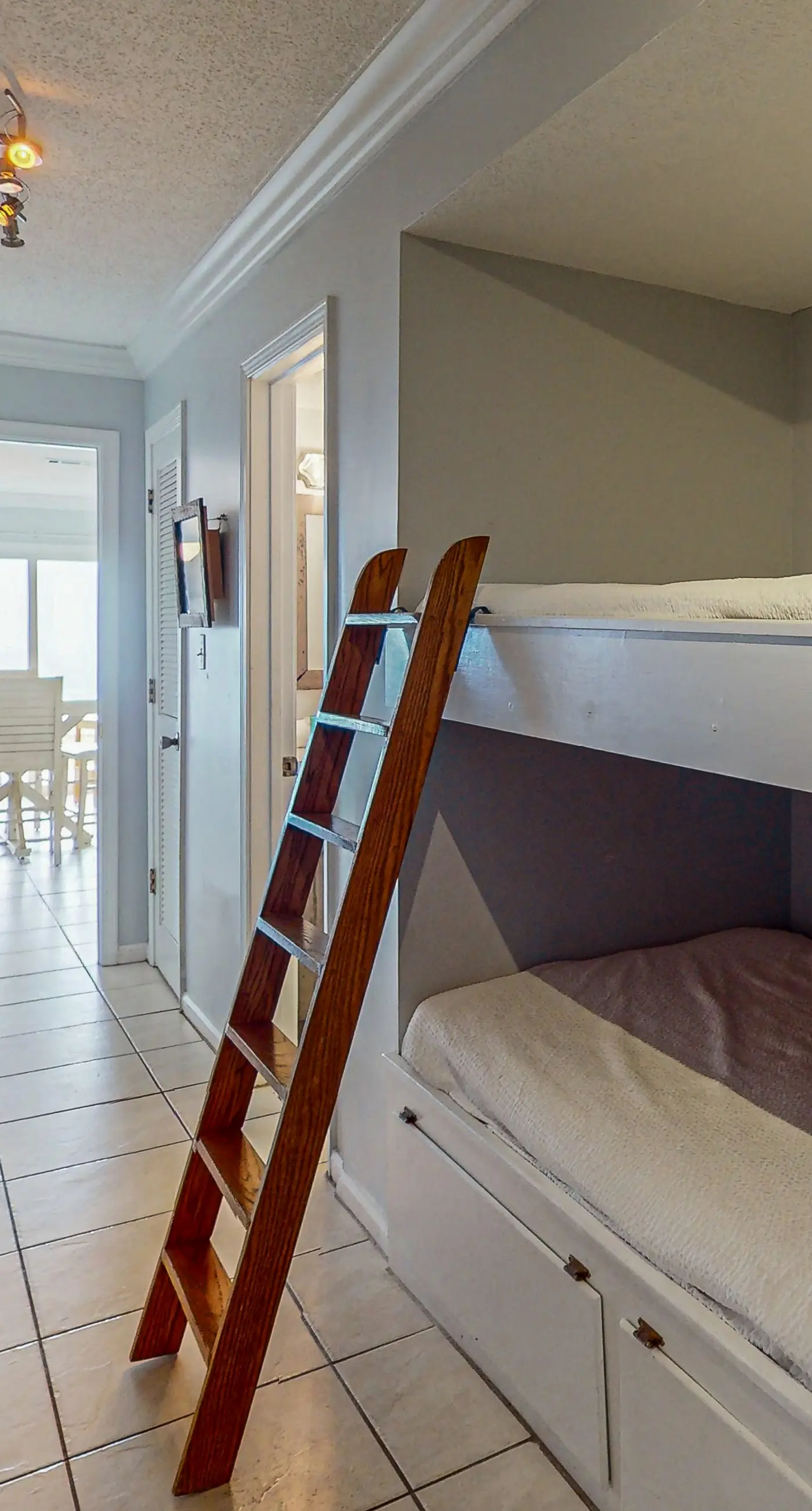 Lovely first floor condo with ocean views, patio, & grill - steps from the beach