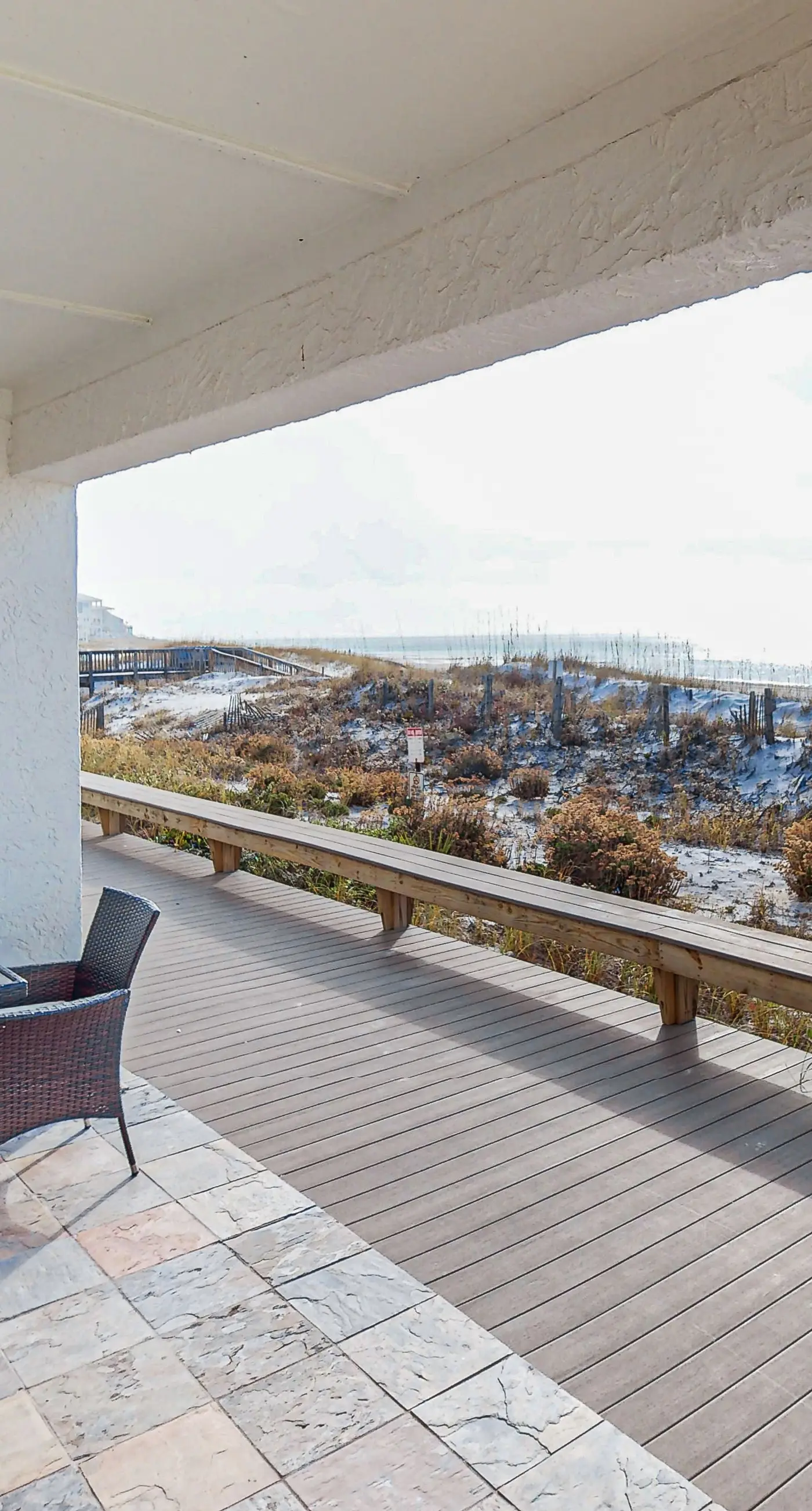 Lovely first floor condo with ocean views, patio, & grill - steps from the beach