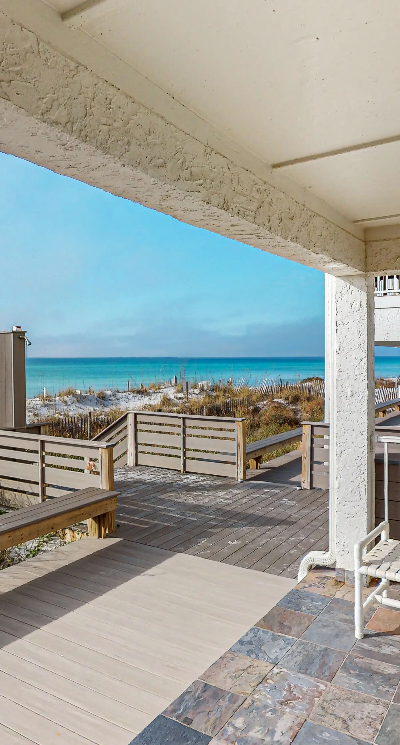 Lovely first floor condo with ocean views, patio, & grill - steps from the beach