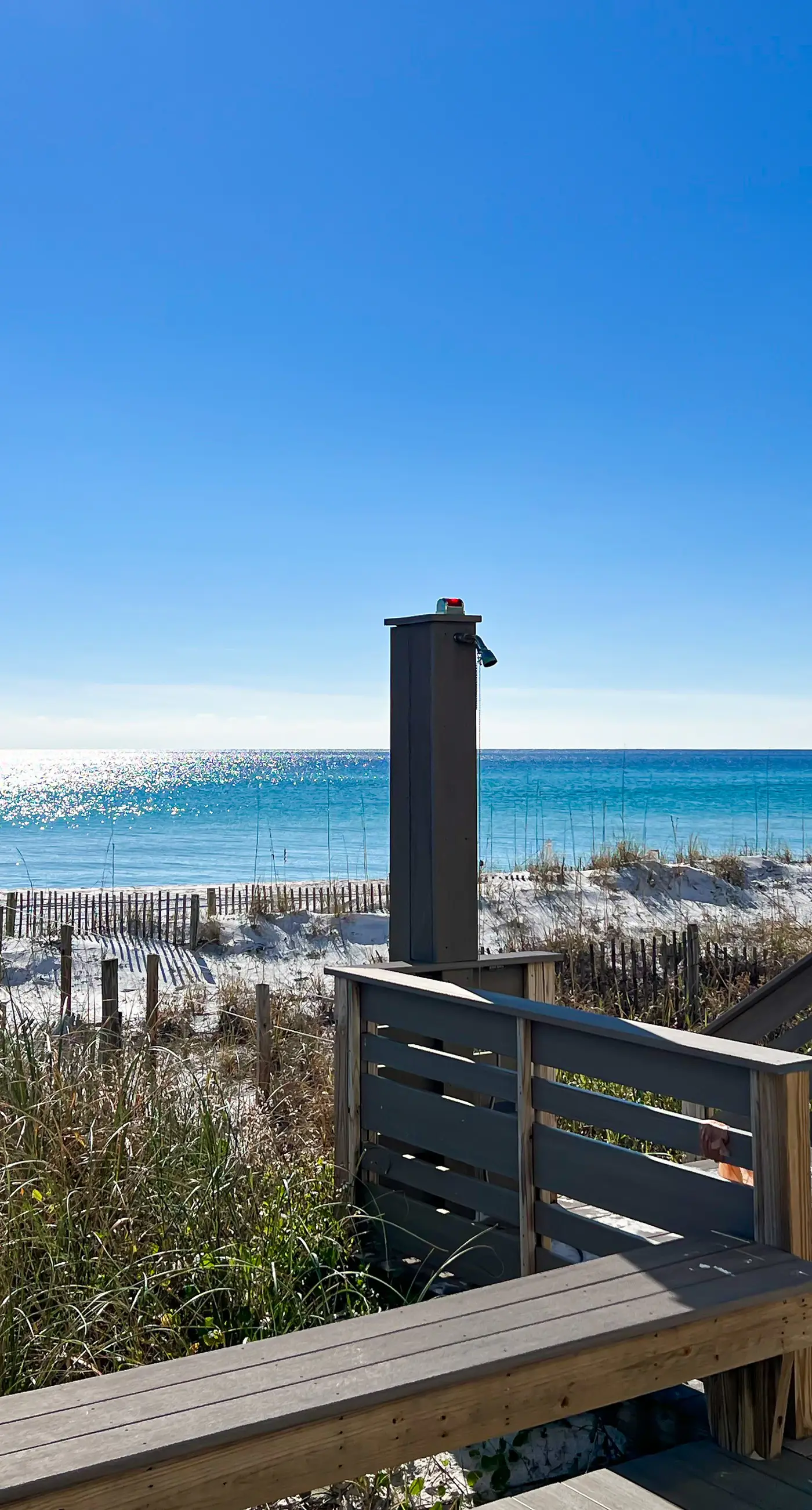 Lovely first floor condo with ocean views, patio, & grill - steps from the beach