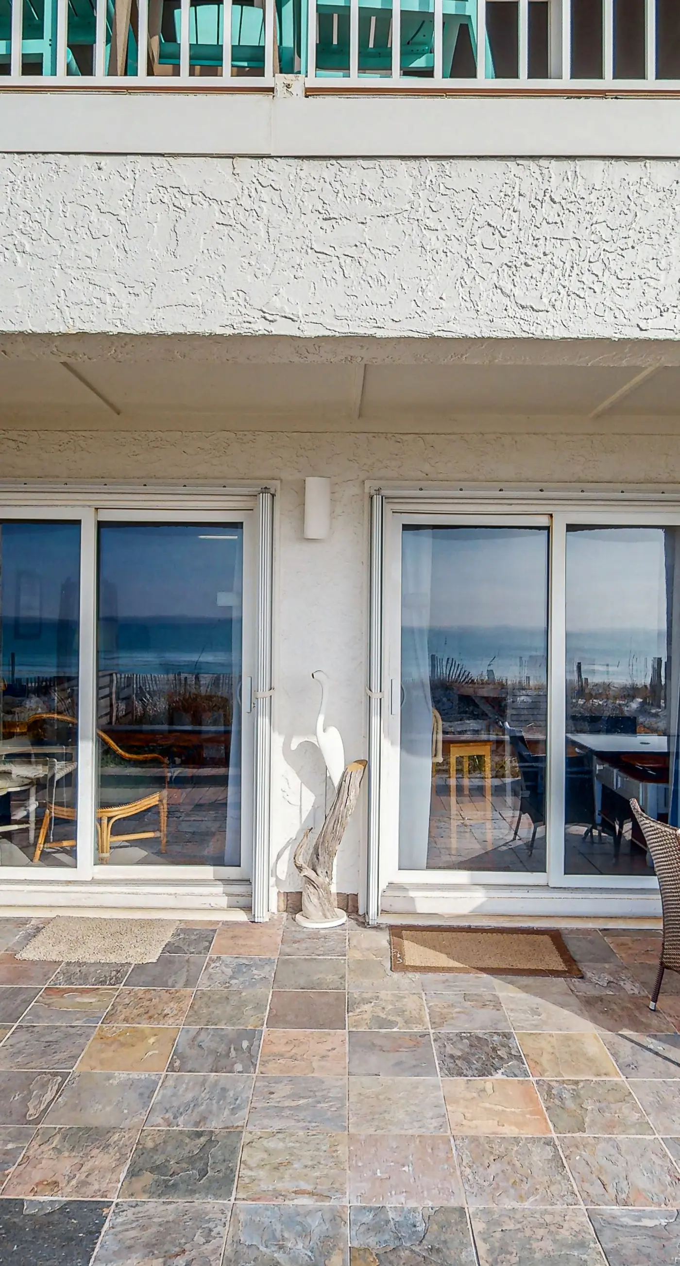 Lovely first floor condo with ocean views, patio, & grill - steps from the beach