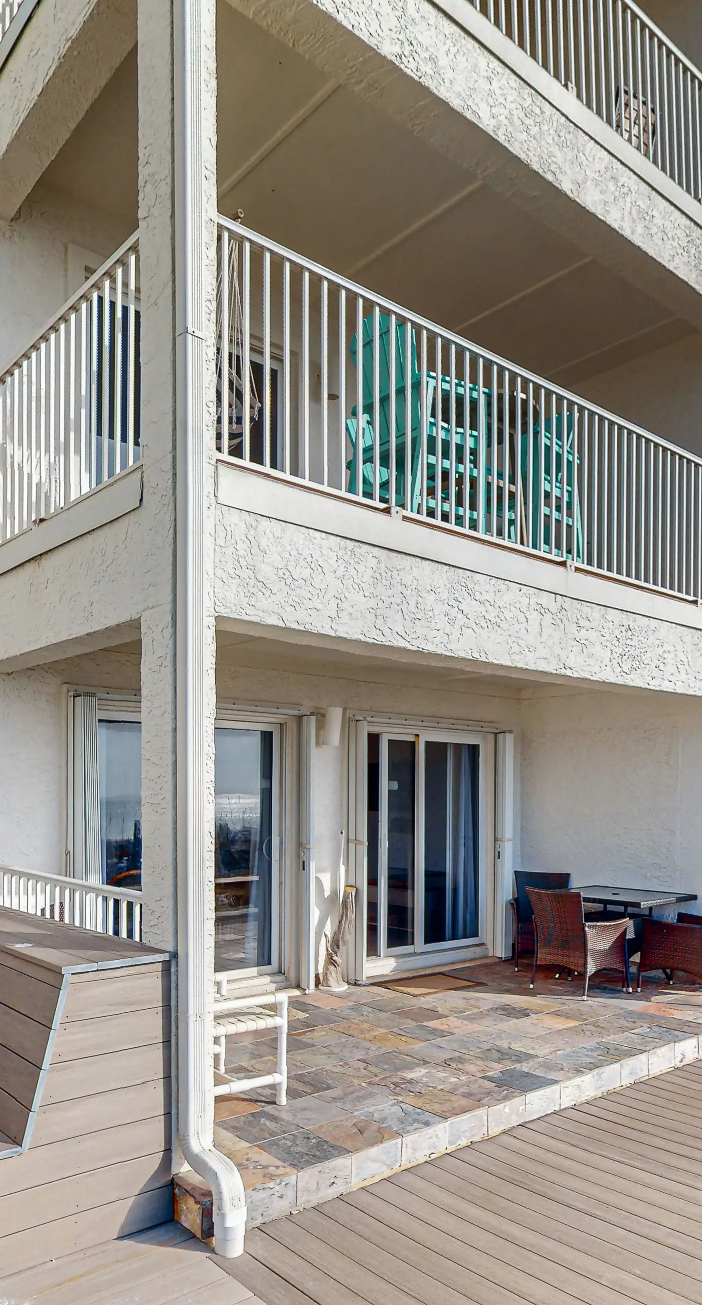Lovely first floor condo with ocean views, patio, & grill - steps from the beach