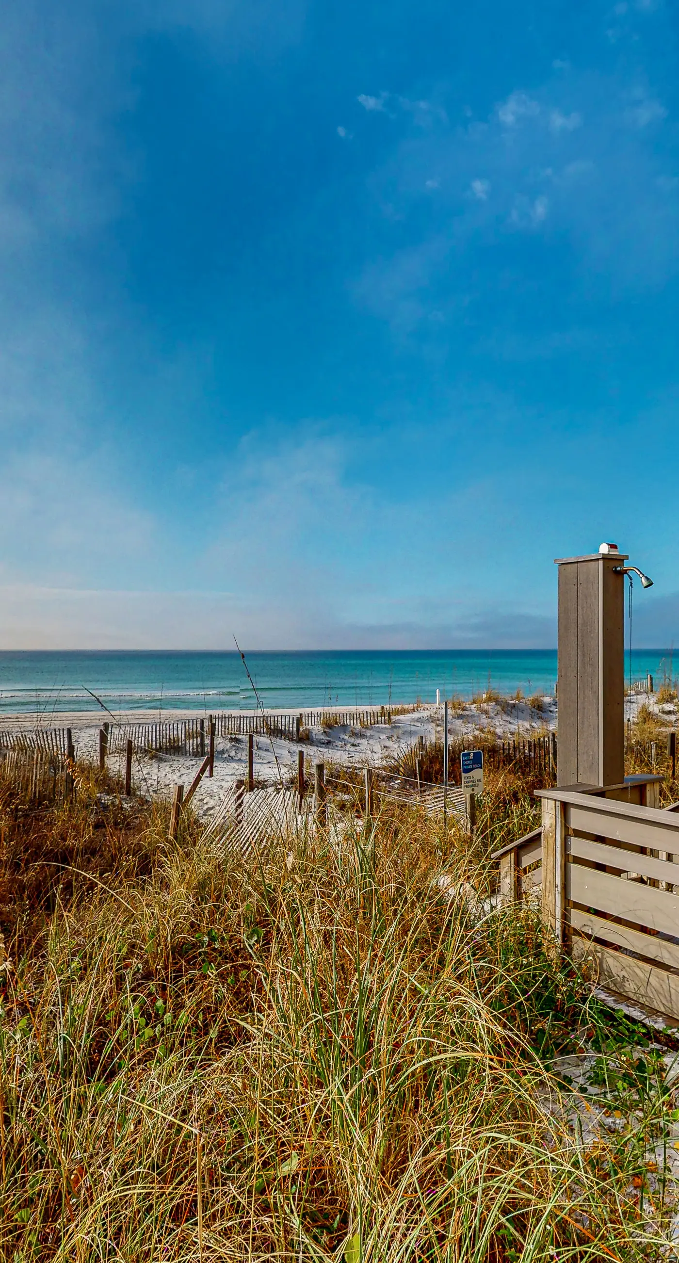 Lovely first floor condo with ocean views, patio, & grill - steps from the beach
