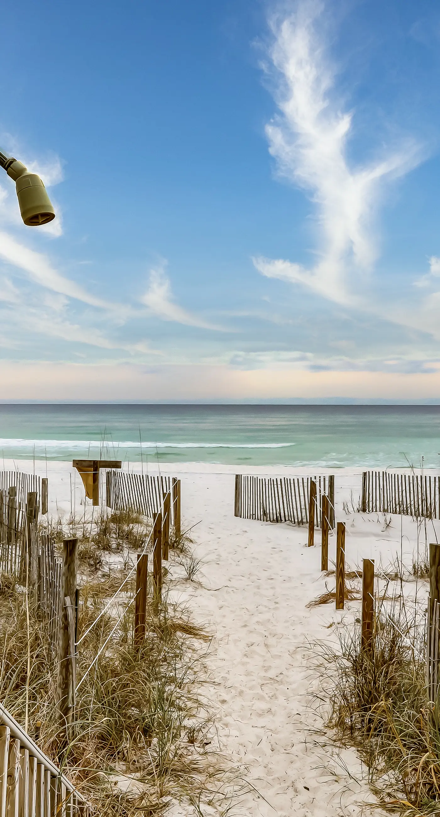 Lovely first floor condo with ocean views, patio, & grill - steps from the beach