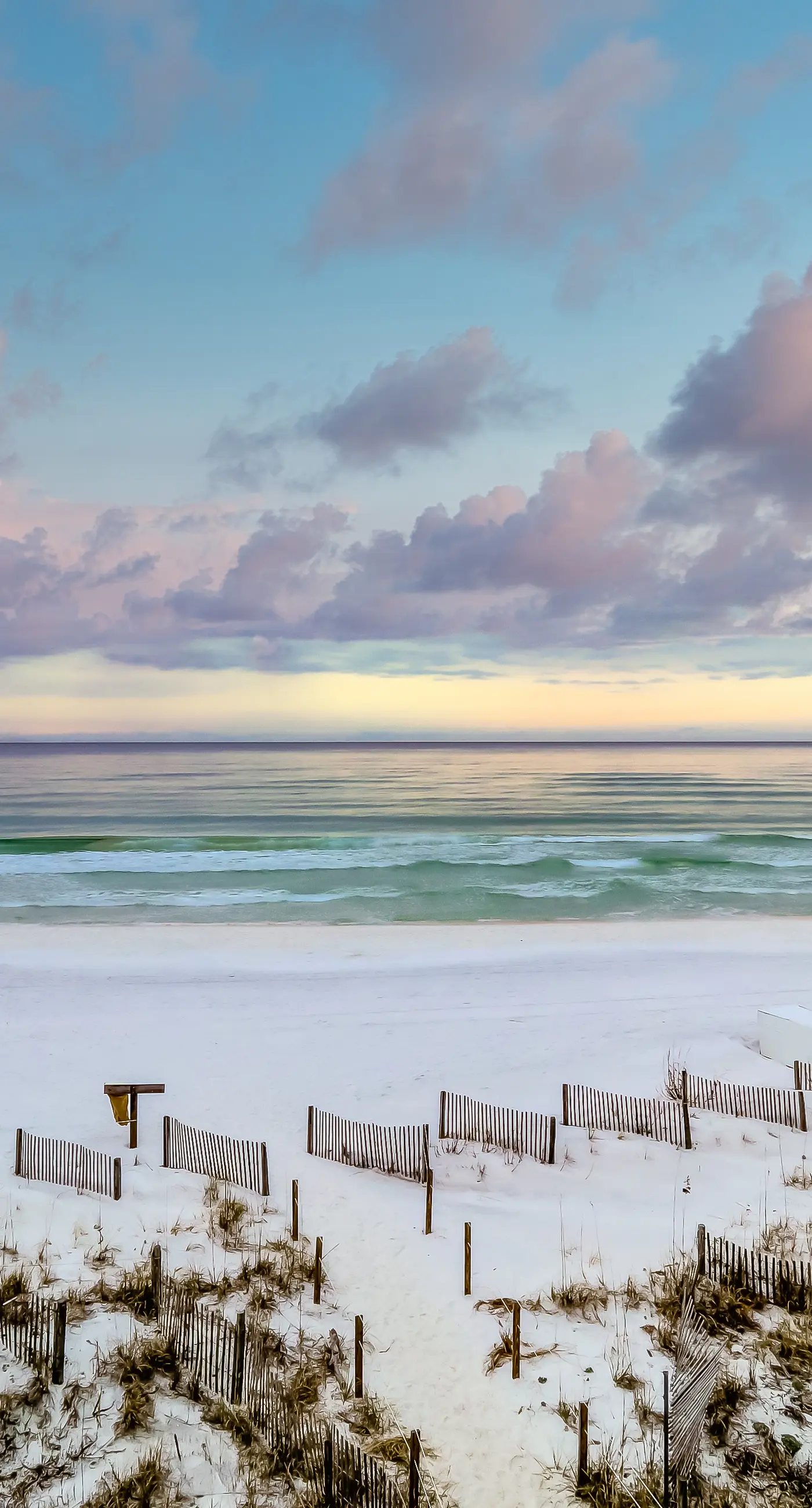 Lovely first floor condo with ocean views, patio, & grill - steps from the beach