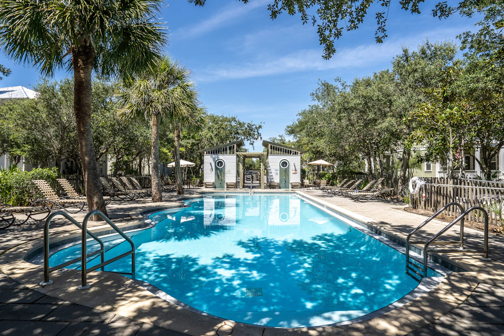 Modern coastal retreat with 2 balconies, grill, central AC, shared Pools, & WiFi