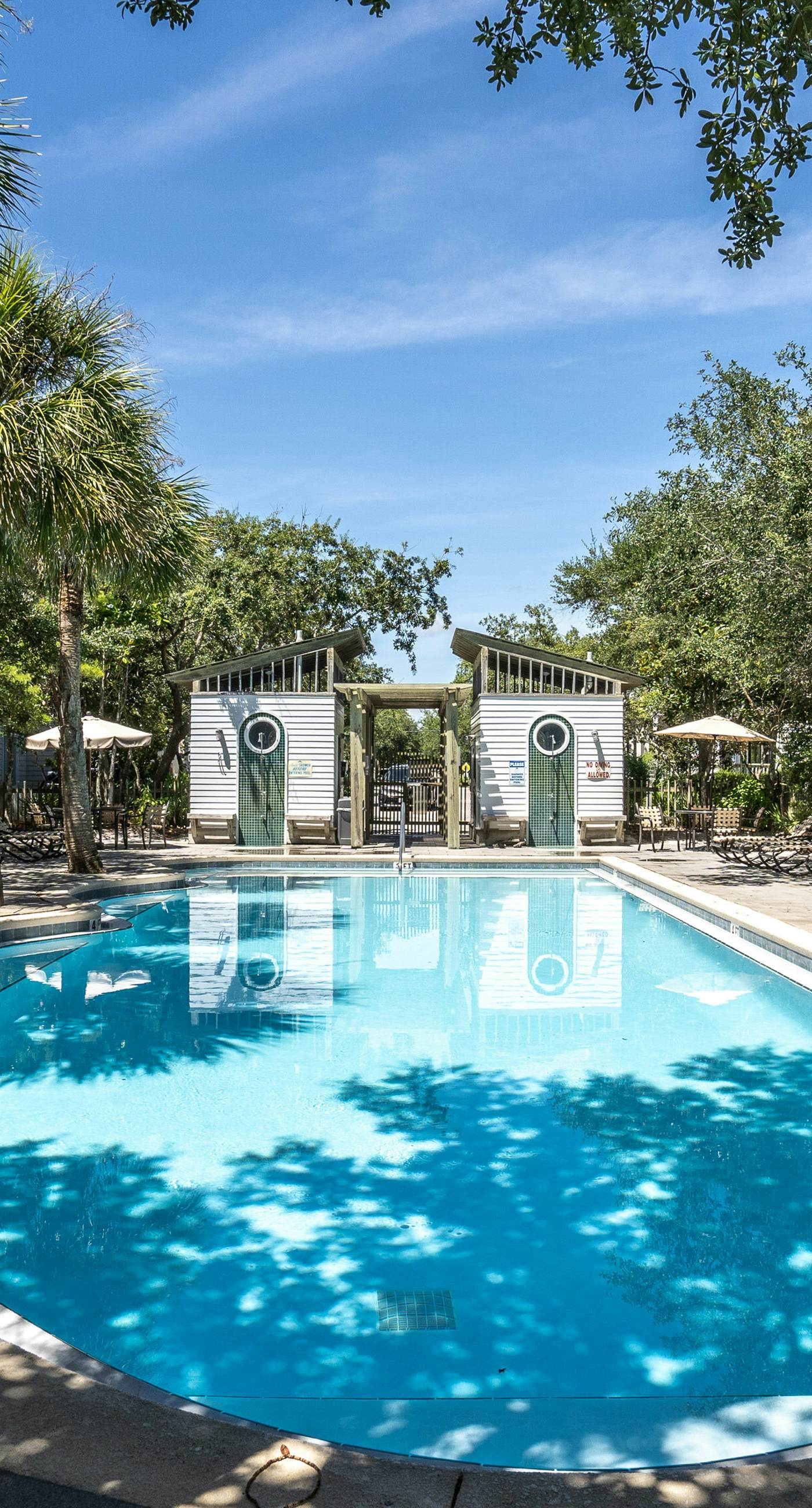 Modern coastal retreat with 2 balconies, grill, central AC, shared Pools, & WiFi