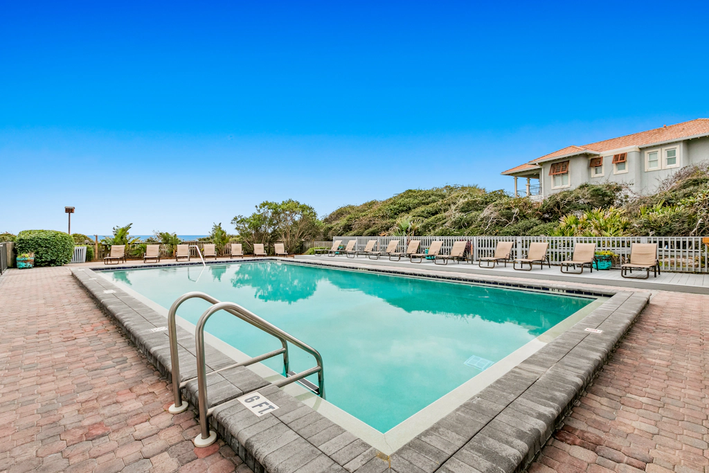 Second floor oceanfront condo with pool access, ocean view, WiFi, W/D, and AC