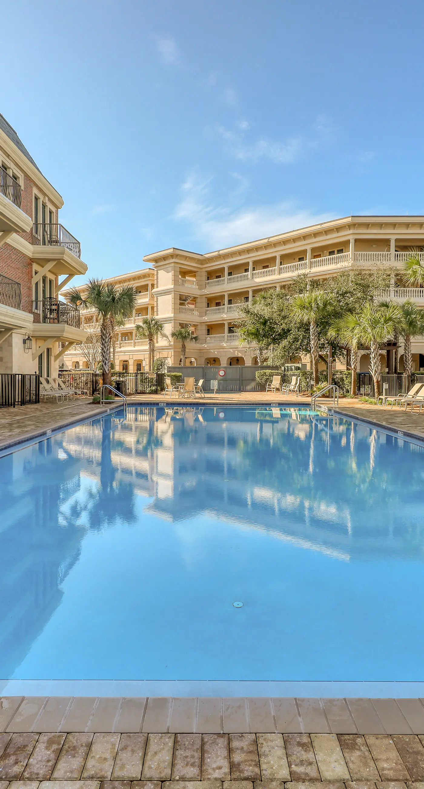 Top floor condo steps to the beach Shared pool & close to shopping & dining
