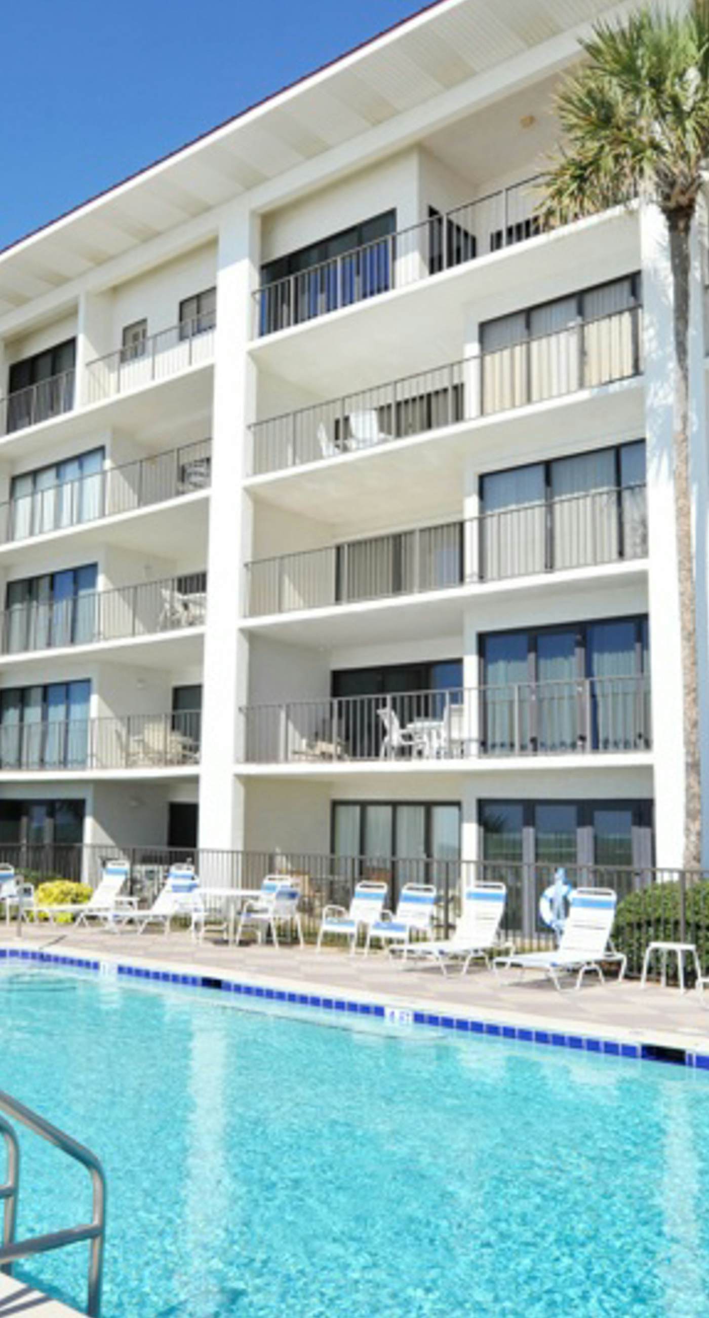 Gorgeous beachfront condo with a pool & private beach access