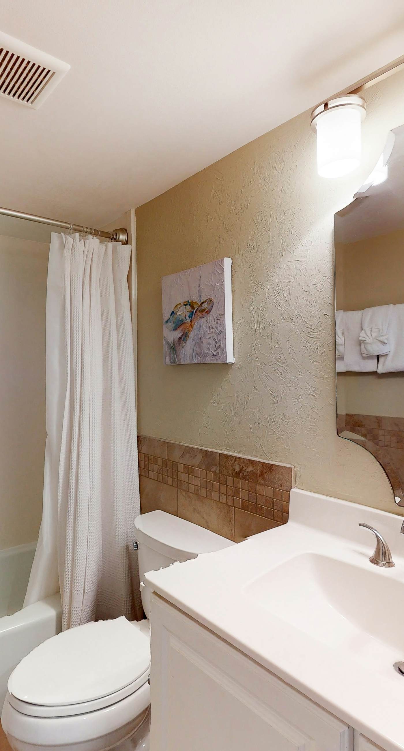 Gorgeous beachfront condo with a pool & private beach access