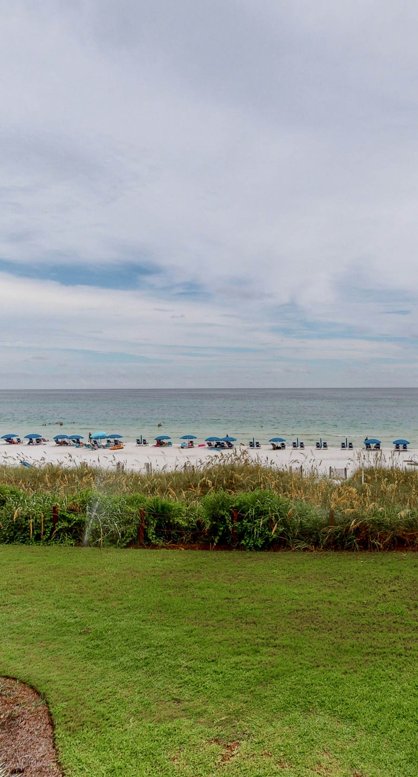 Gorgeous beachfront condo with a pool & private beach access