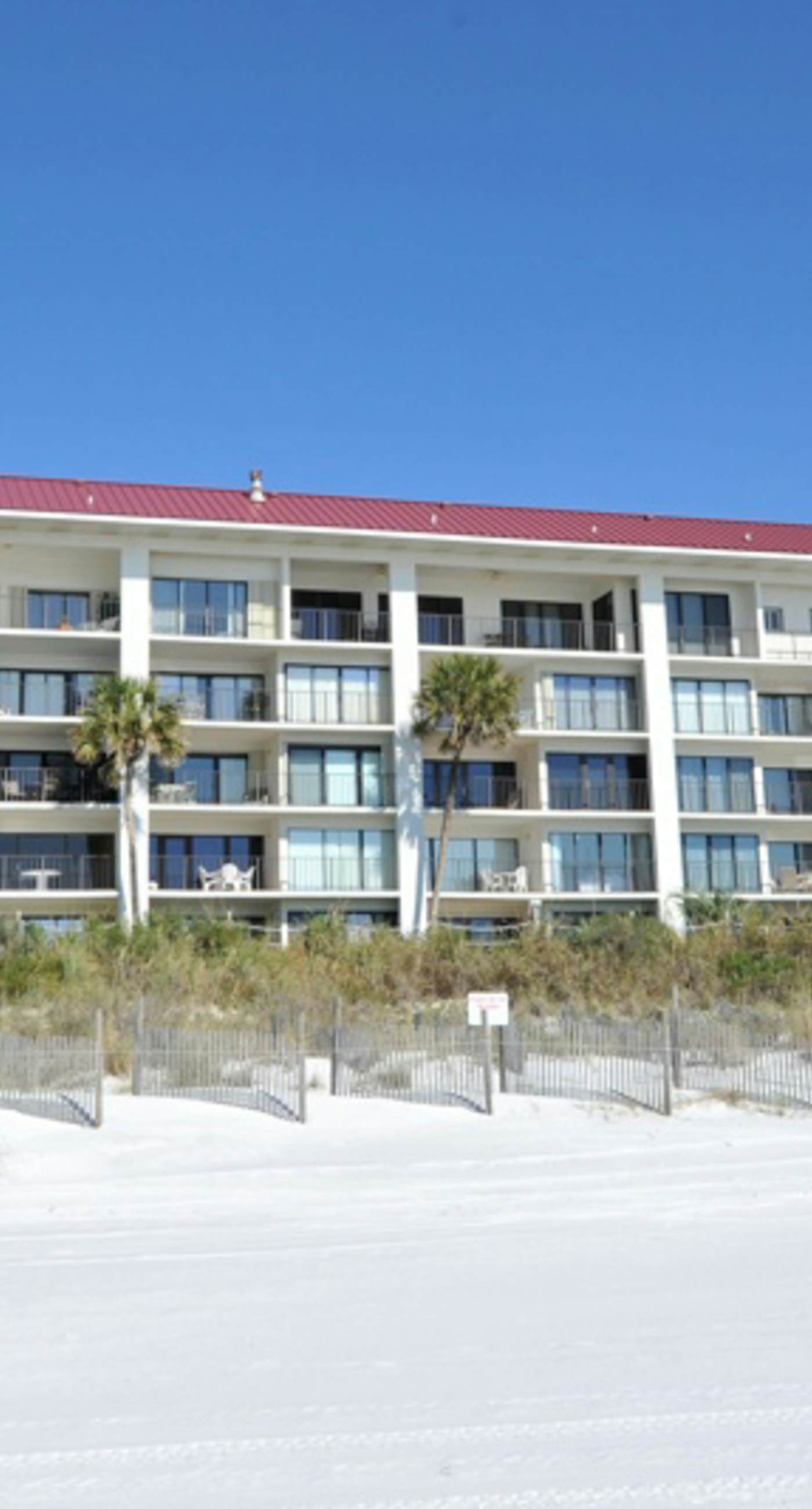 Gorgeous beachfront condo with a pool & private beach access